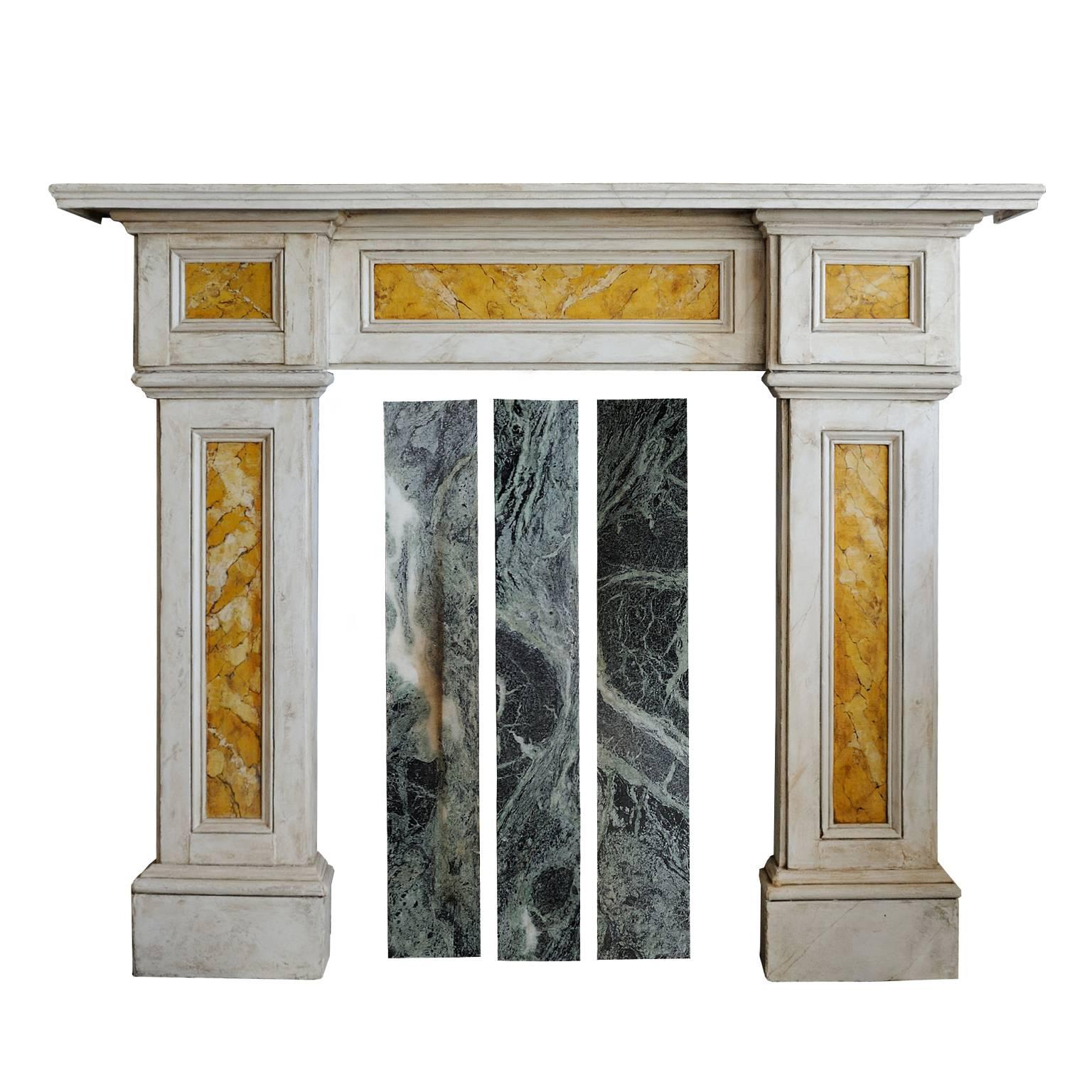 This is a really rather beautiful and elegant English late Georgian wooden fireplace, faux painted to resemble white marble and sienna marble with real green marble slips, a really striking addition to your room, circa 1830.