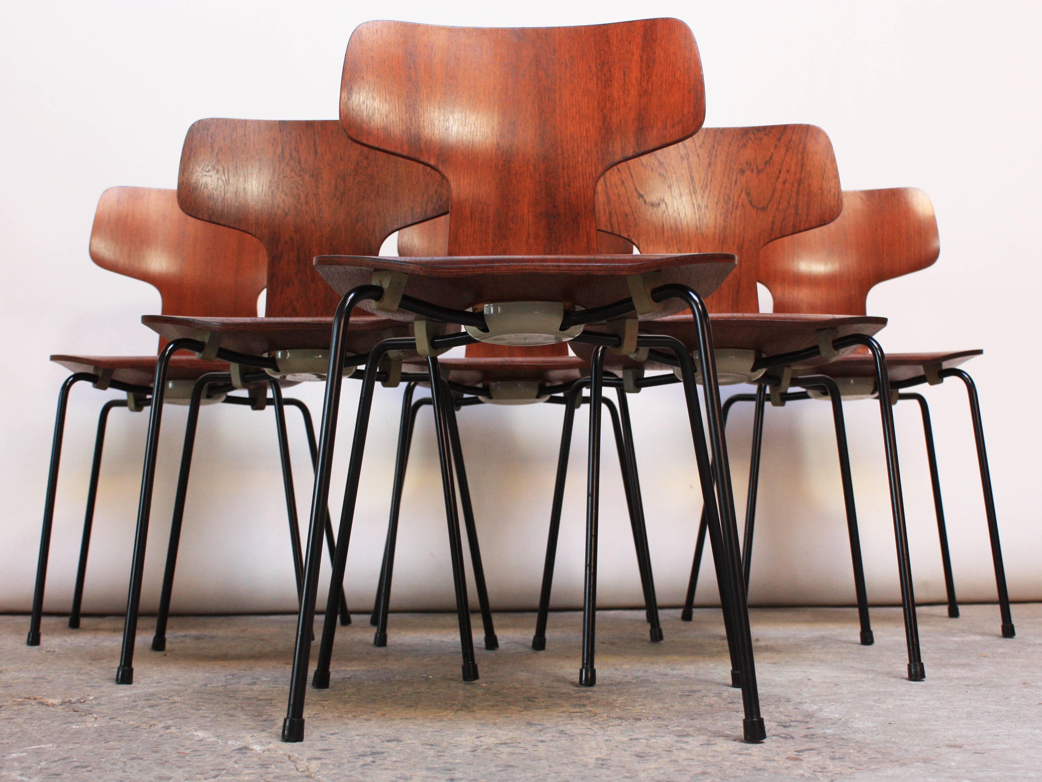 This set of six Arne Jacobsen for Fritz Hansen molded teakwood stacking chairs has been expertly restored. Each chair retains the original hardware (spacers, feet, and caps - branded with the Danish Control / Fritz Hansen markings). Additionally,