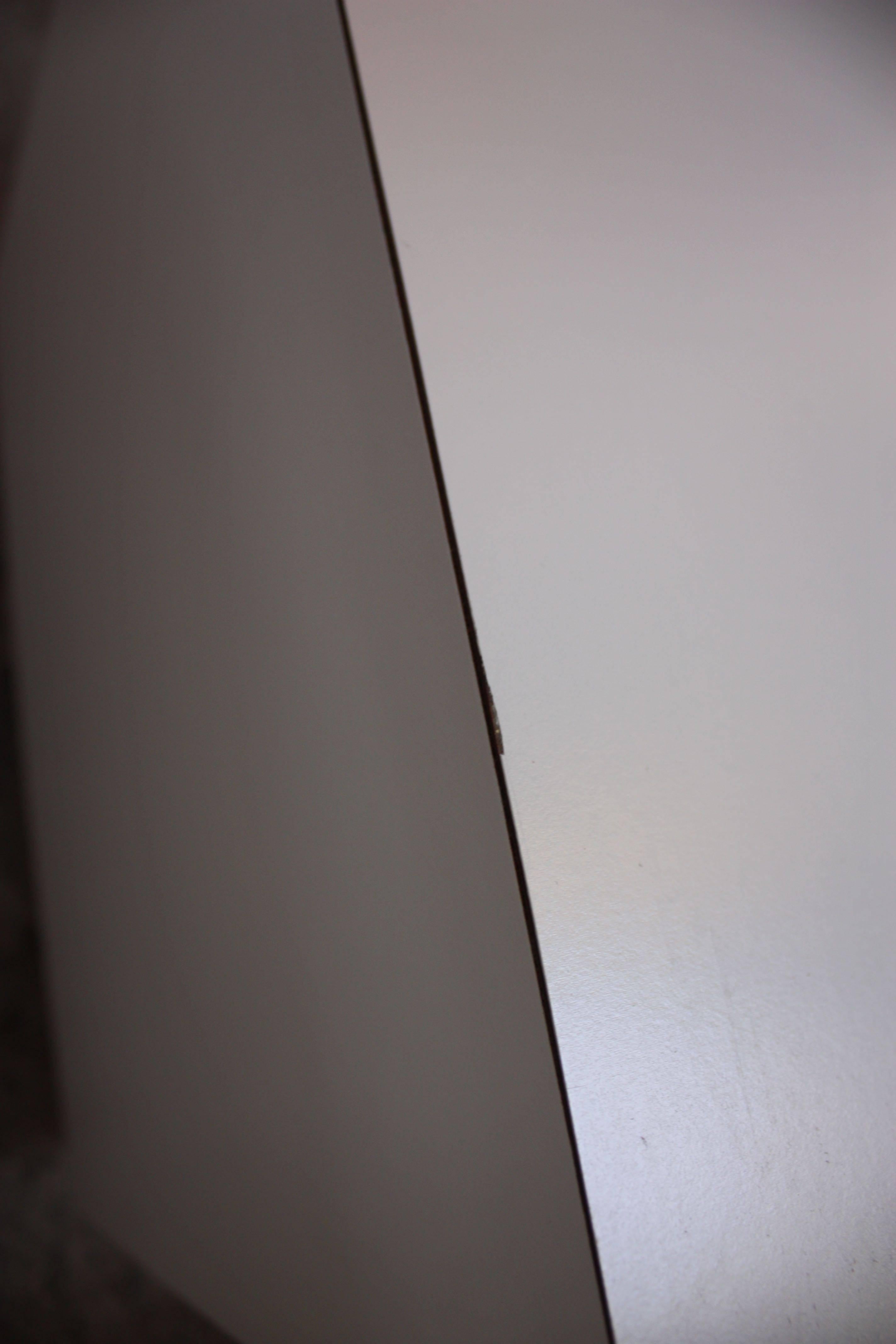 These cube end tables / display pedestals are comprised of two sides of rosewood veneer and three sides of white laminate over a rosewood veneer plinth base.
Although these tables are reminiscent of a similar design by Milo Baughman and Adrian