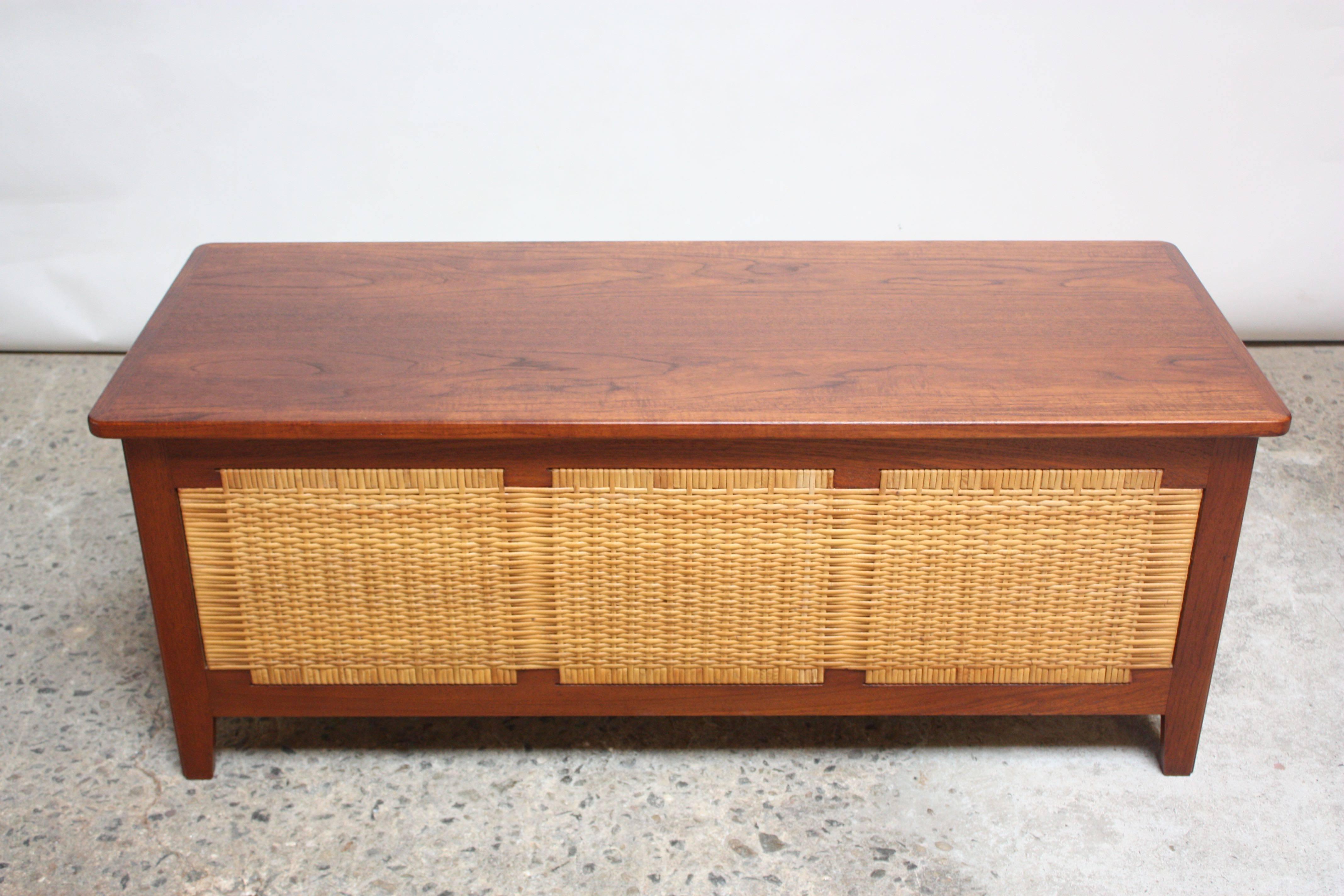 This blanket chest was designed in the 1960s by Kaj Winding for Poul Hundevad. This model was manufactured in two sizes (36