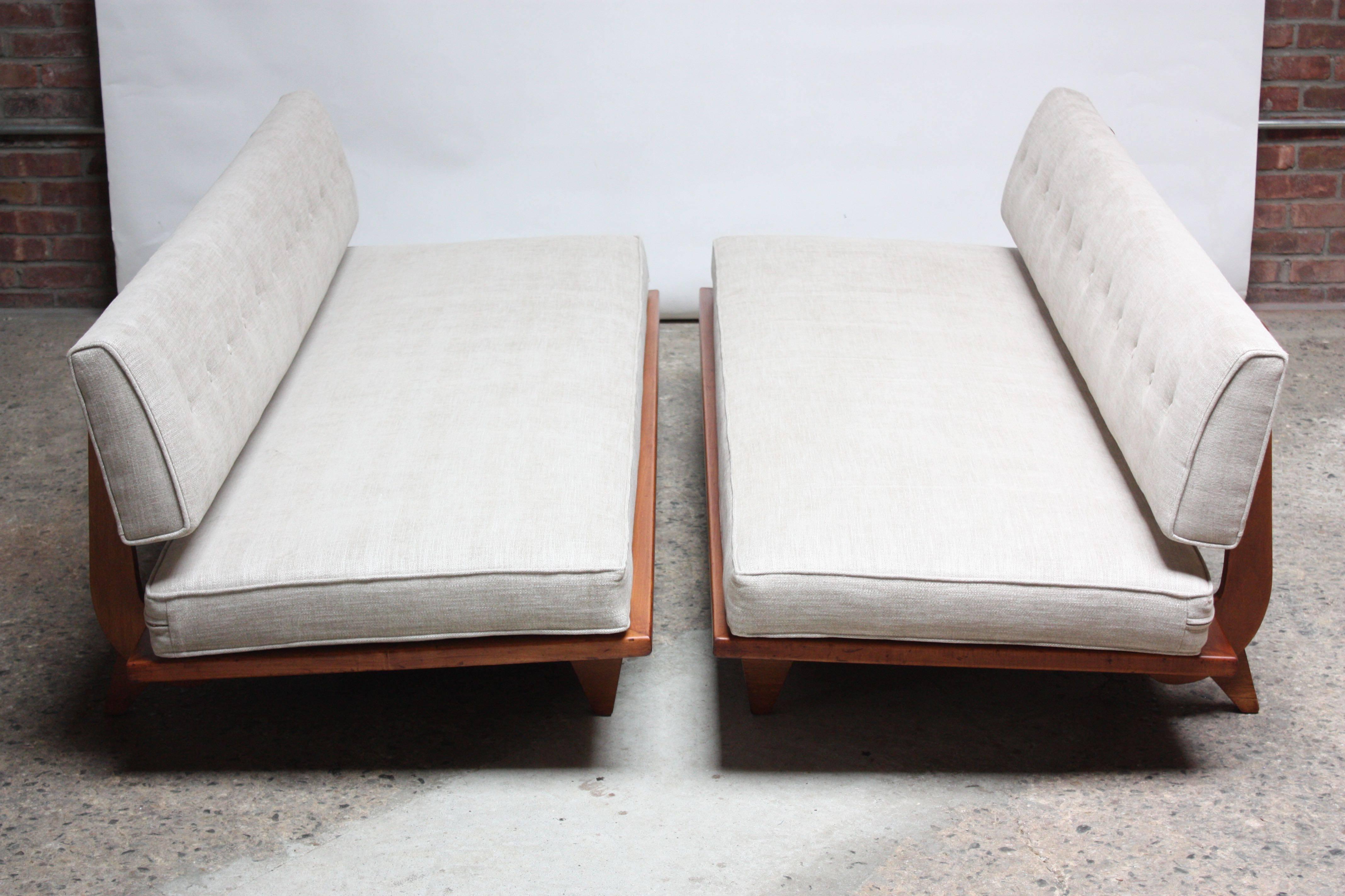 These sofa sleepers (model #700) were designed by Richard Stein for Knoll in 1947. The foot pedal under the seat lowers the upholstered seat back. It can recline to a 45 degree angle, or drop down entirely, so the back frame is even with the ground.