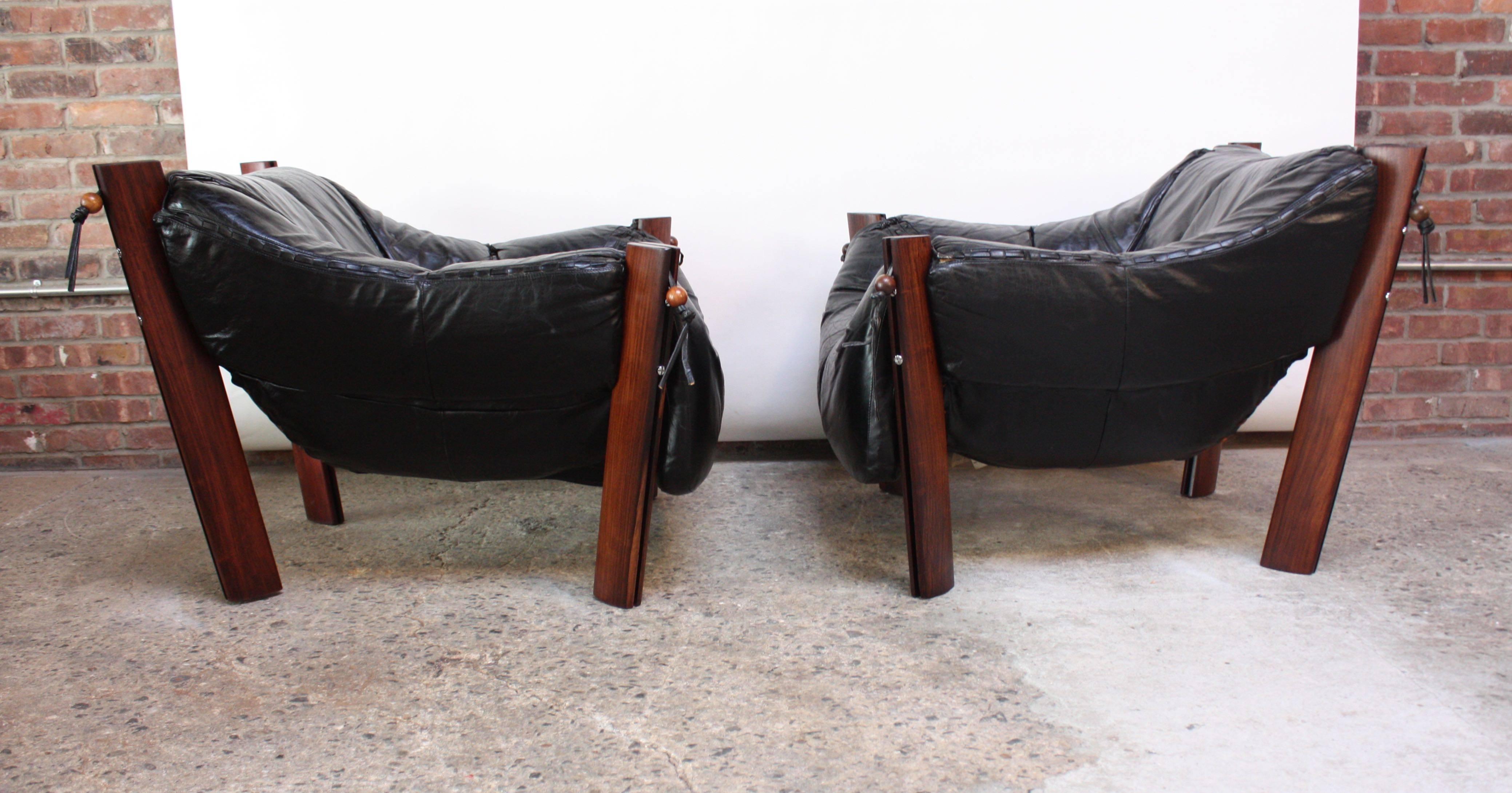 Brazilian Pair of Jacaranda and Leather Lounge Chairs and Ottoman by Percival Lafer