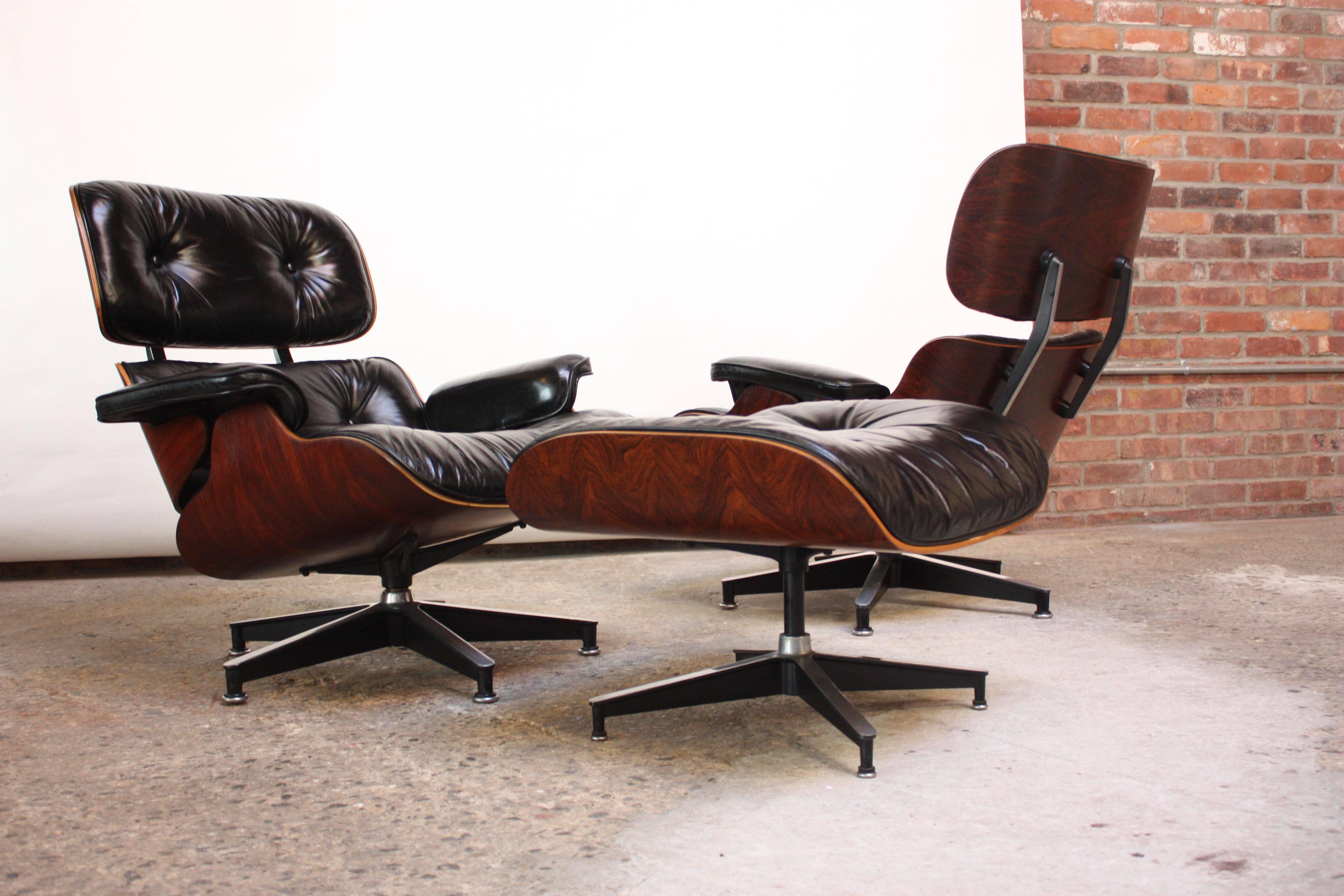 Iconic pair of 670 lounge chairs and single matching 671 ottoman by Charles and Ray Eames for Herman Miller. These are early-mid 1970s examples (one chair is marked 1975, as shown) and retain the black rectangular Herman Miller tags.
These will come