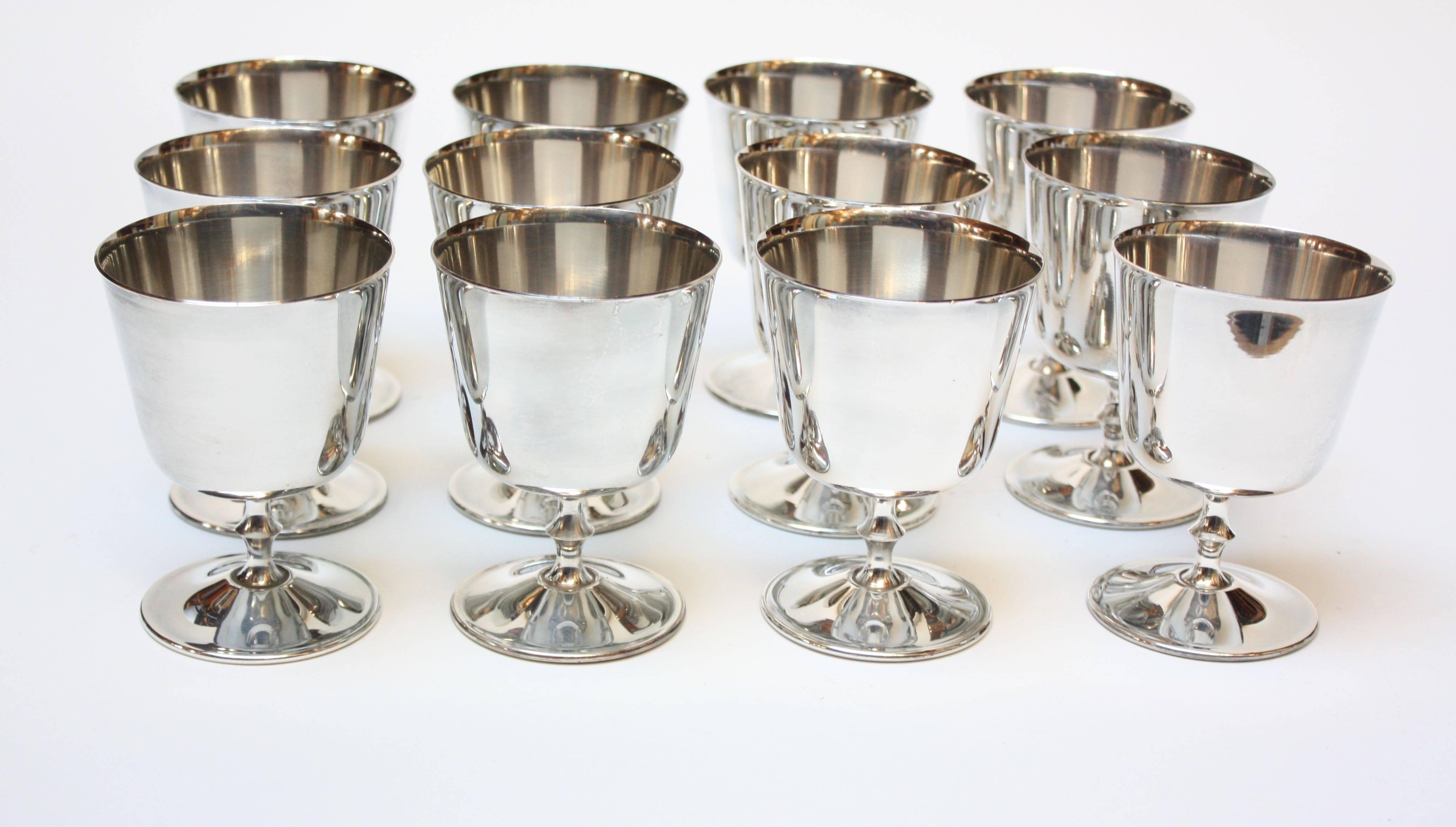Set of 12 silver plated goblets with decorative stems by De Uberti of Italy (early 1970s). Excellent, vintage condition and polished to bring out the original luster. 
Branded on underside De Uberti / EL (their US Partner, Eisenberg-Lozano).