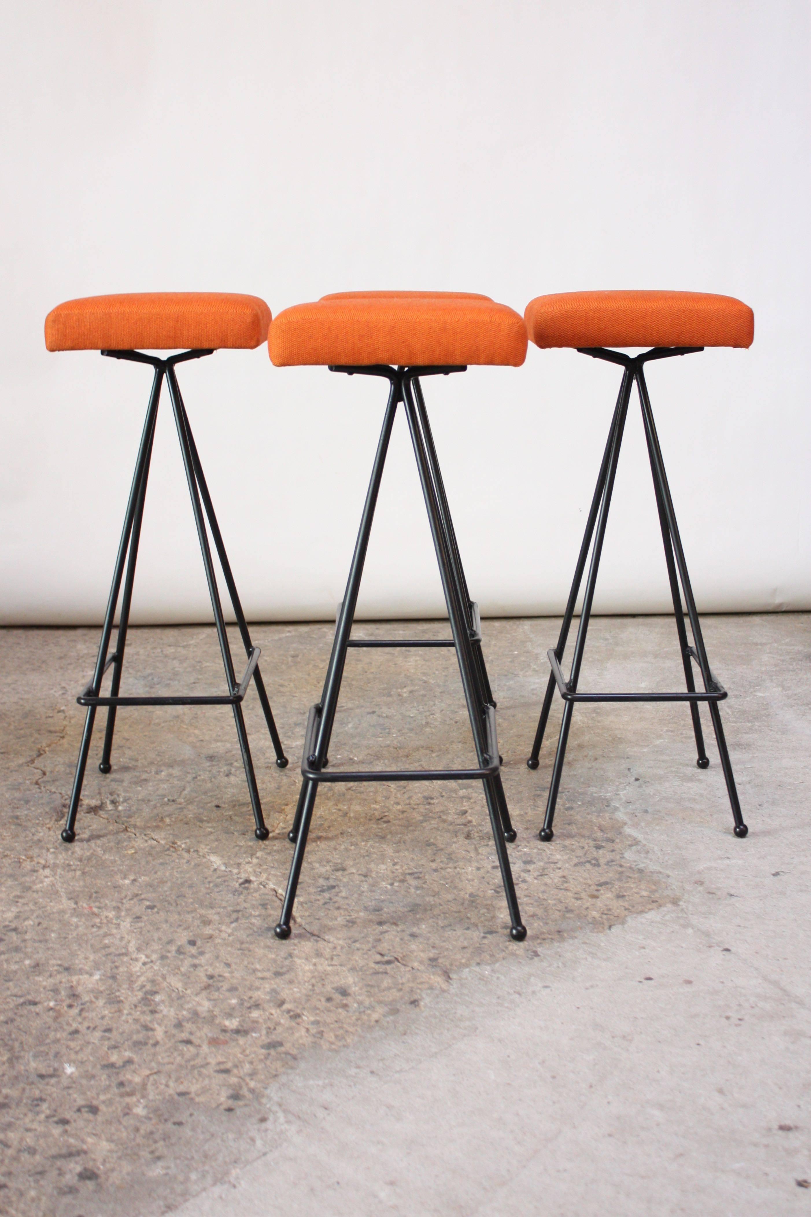 Rare, early set of #11 barstools designed by Adrian Pearsall for Craft Associates in the 1950s. Forged wrought iron construction with footrest and ball feet. Newly recovered in a vintage hopsack fabric. Retain the 'Craft Associates' tags to the