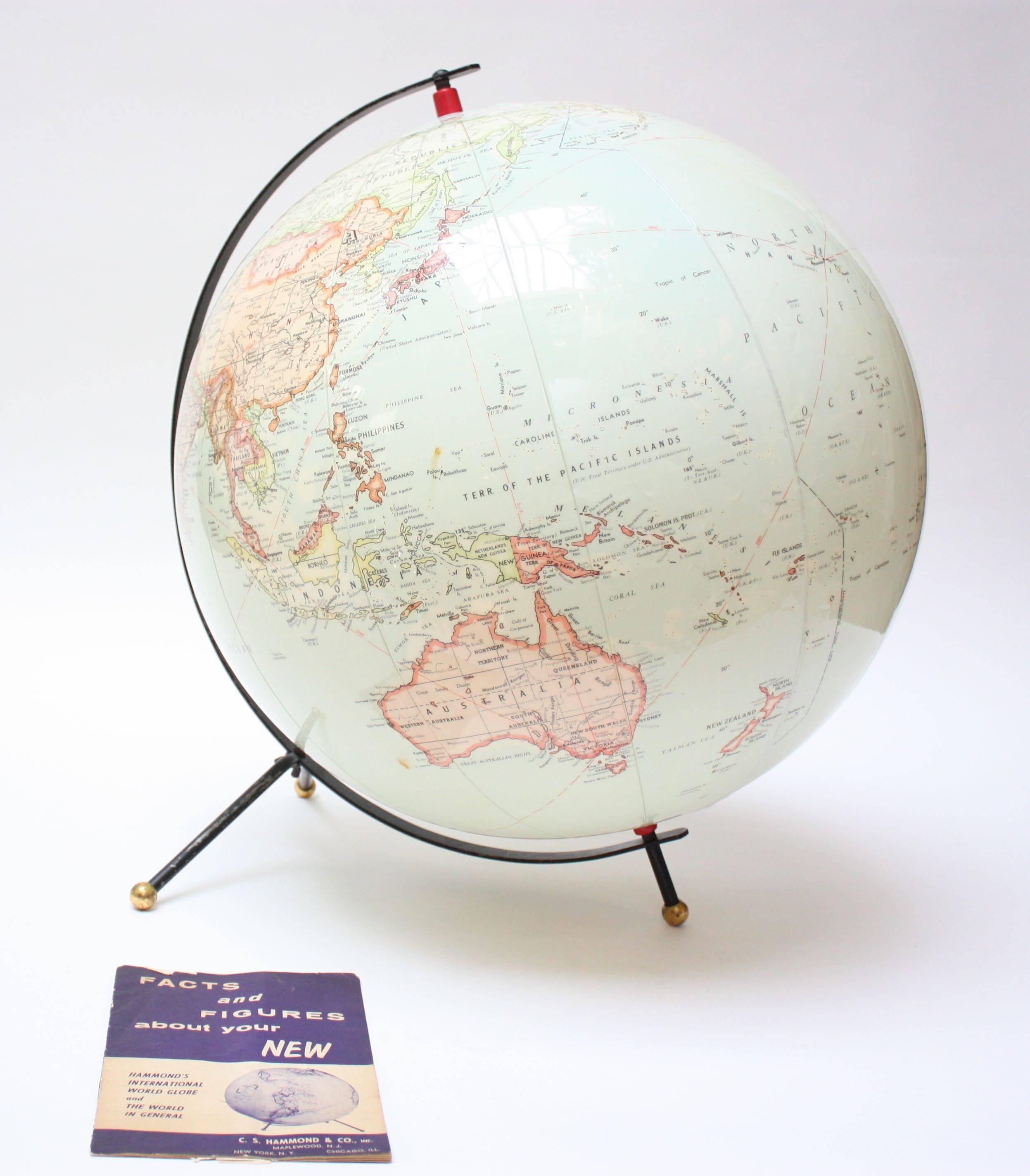 Hammond's International Globe (ca. 1955) composed of an inflatable globe on painted metal cradle. Images and font are large in scale and very legible. As durable as a beach ball, this vinyl globe is inflatable / deflatable by means of a locking port