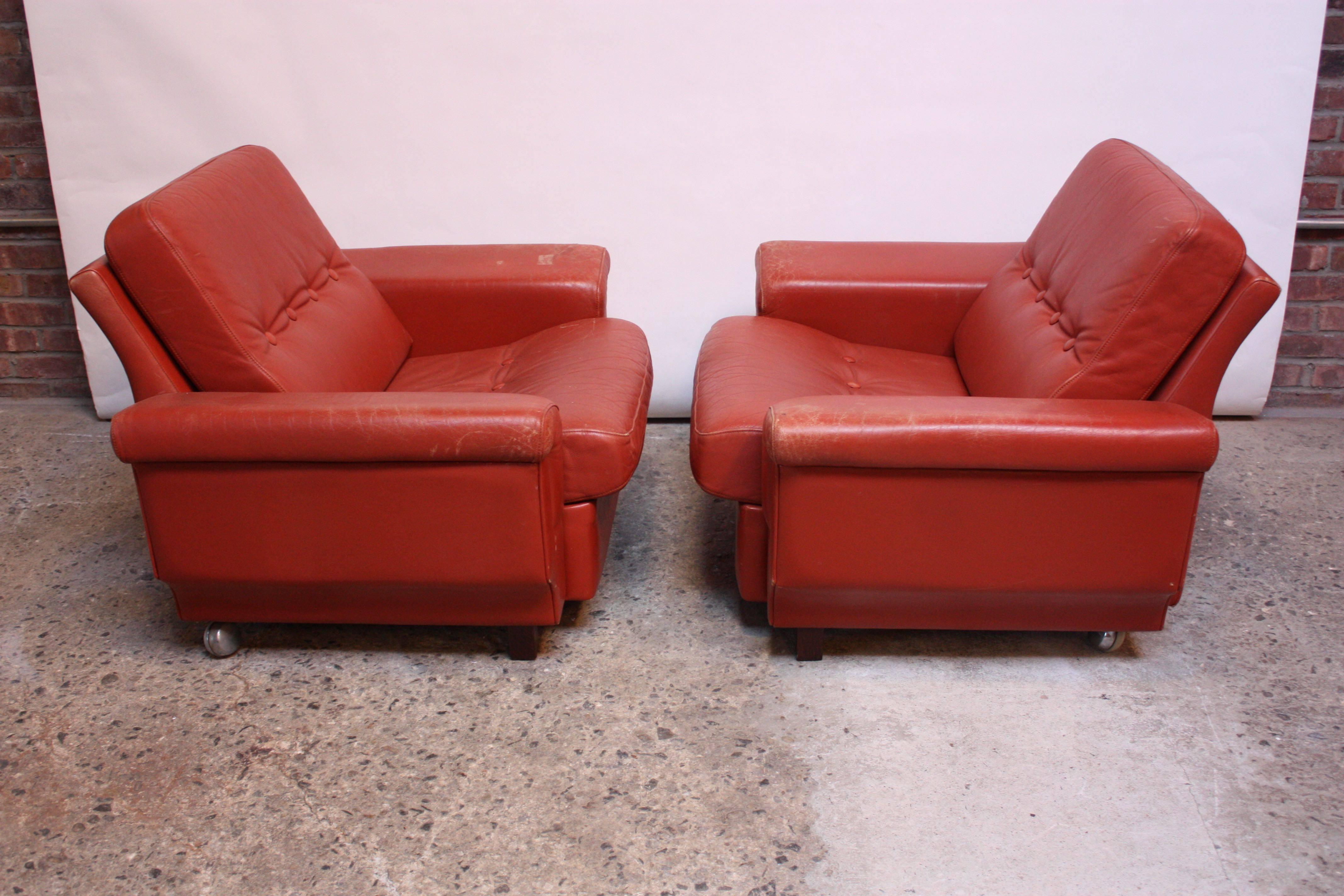 Stained Pair of Danish Modern Lounge Chairs in Coral Leather