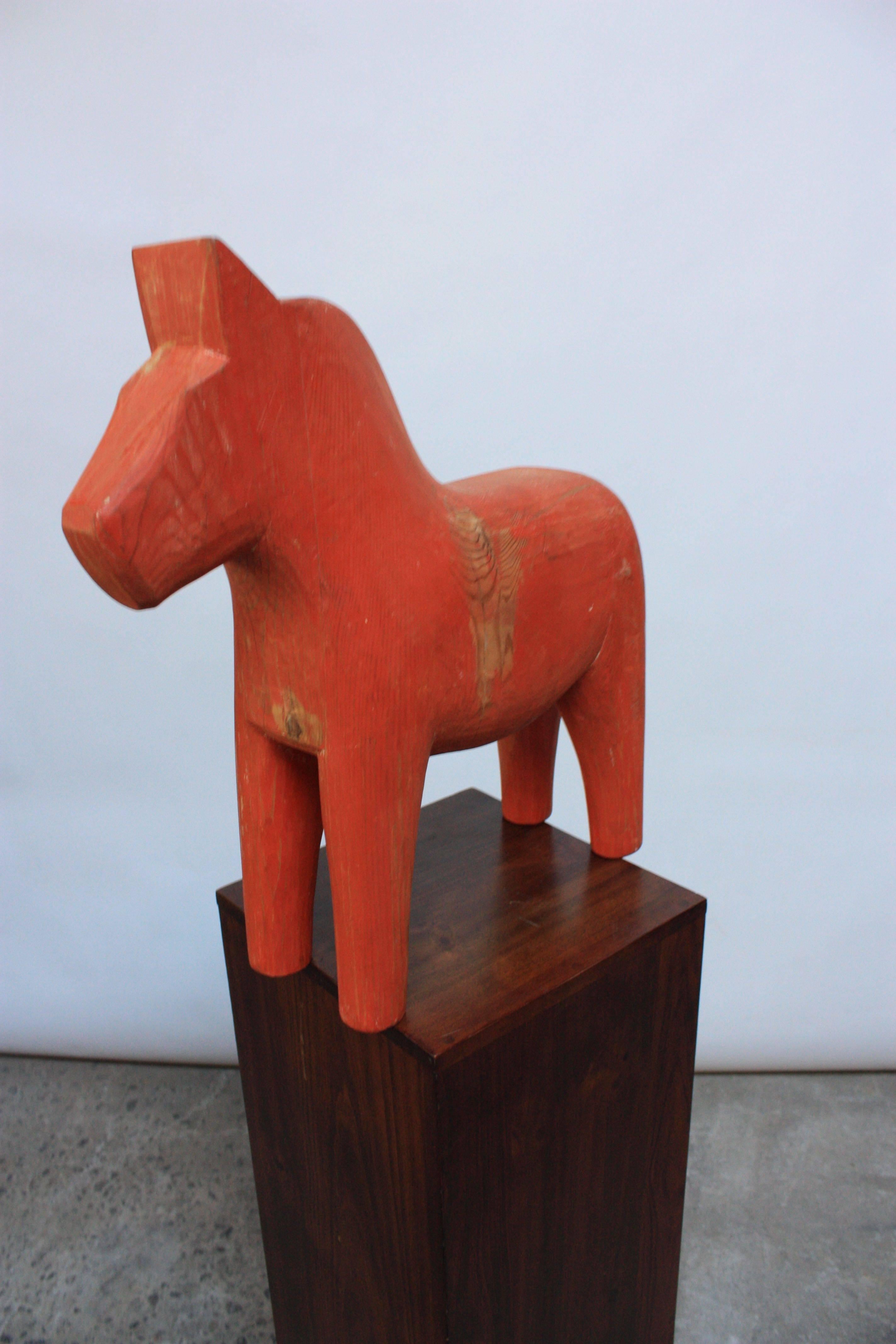 This Dala horse is an unusual example given both its size and appearance. It measures 19.25