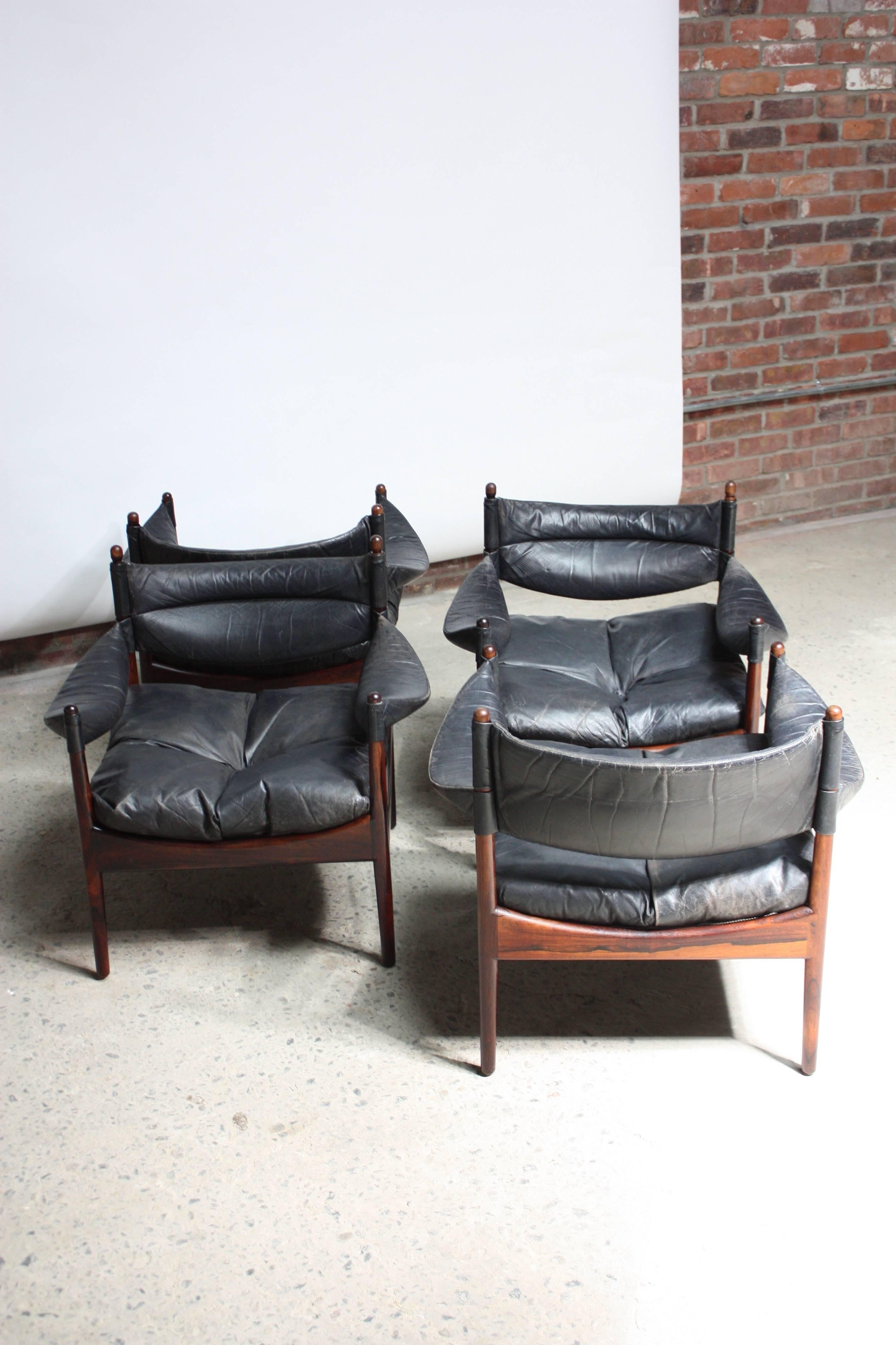 This set of four Kristian Solmer Vedel 'Modus' lounge chairs in rosewood and black leather is in good, vintage condition, with nice age/wear to the leather. The original owner had an Arne Jacobsen '6-star series' rosewood table custom-made to fit