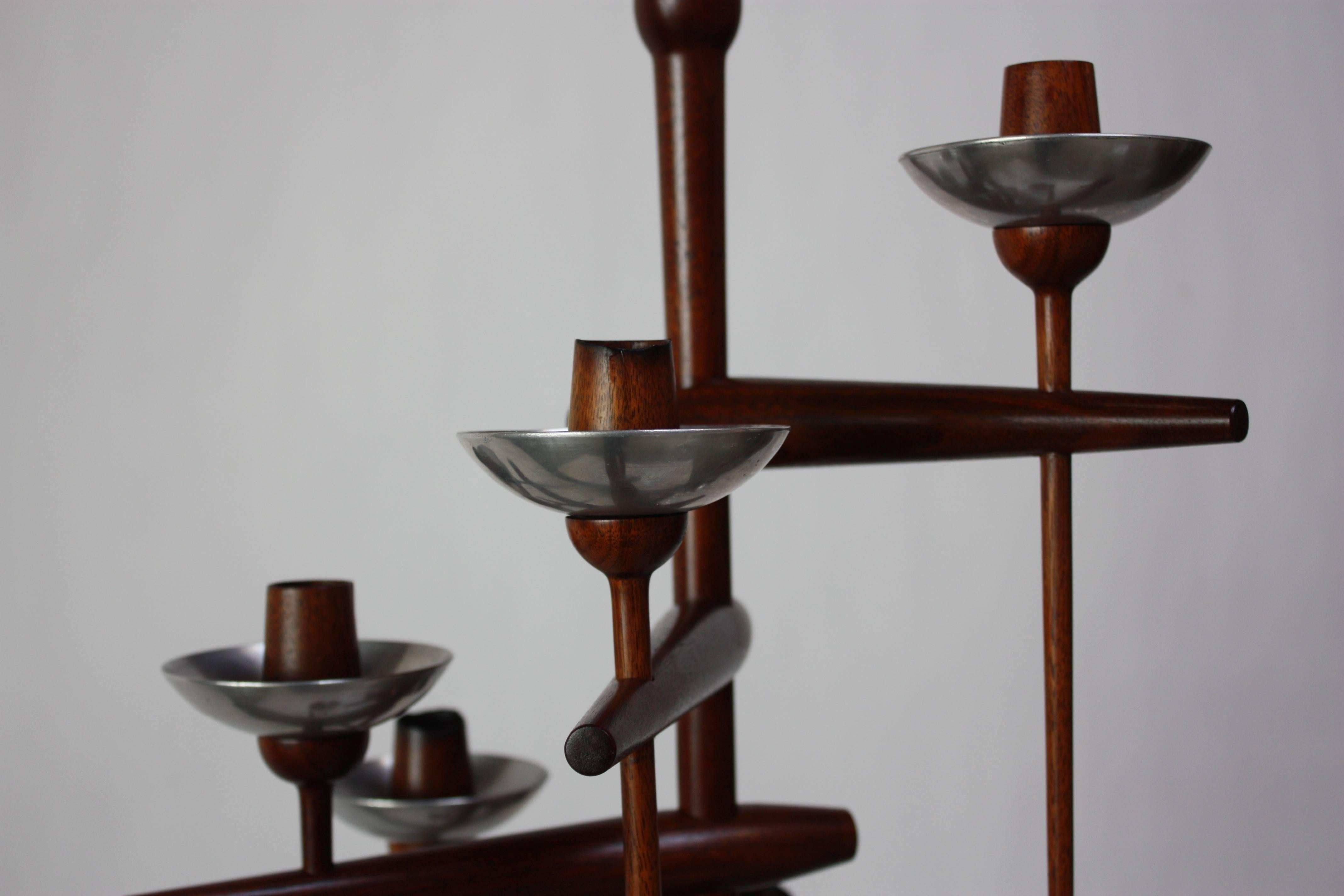 This masterful floor candelabrum was designed and manufactured by the Bucks Country, Pennsylvania woodworker, Herbert (Herb) Simonson, and retailed at James Martin's studio. Martin served as an extended apprentice to George Nakashima and often