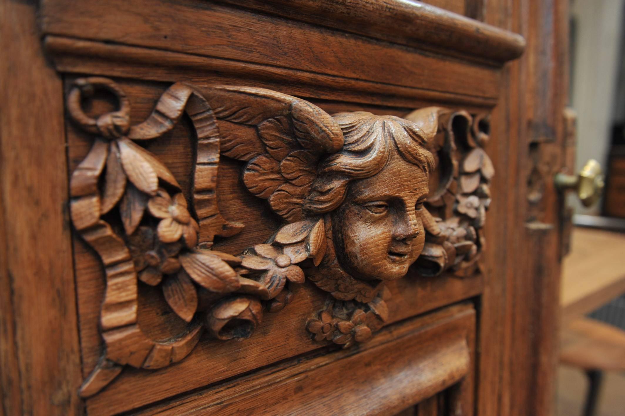 Antique French entrance or inside Renaissance door great carved oak with cherubs and columns. Curtains carving on back side, circa 1750.