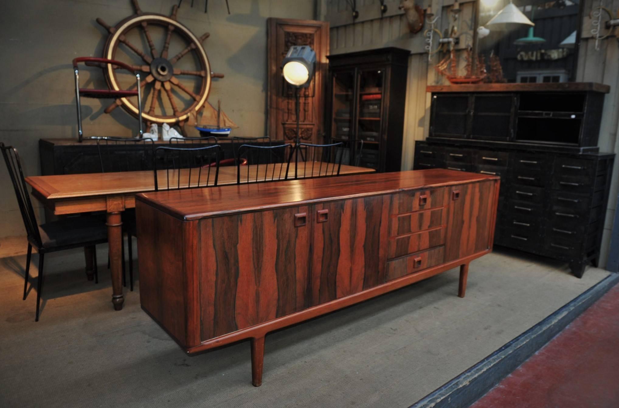 Three doors one drawers and one bar sliding door, Mid-Century
rosewood sideboard credenza, circa 1950.