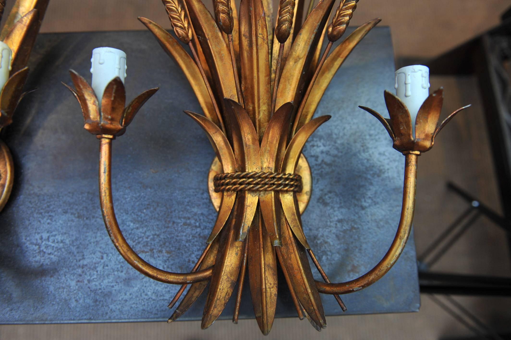 Mid-Century Modern 1940s French Gold Leaf Gilt Iron Two-Light Wall Sconces For Sale