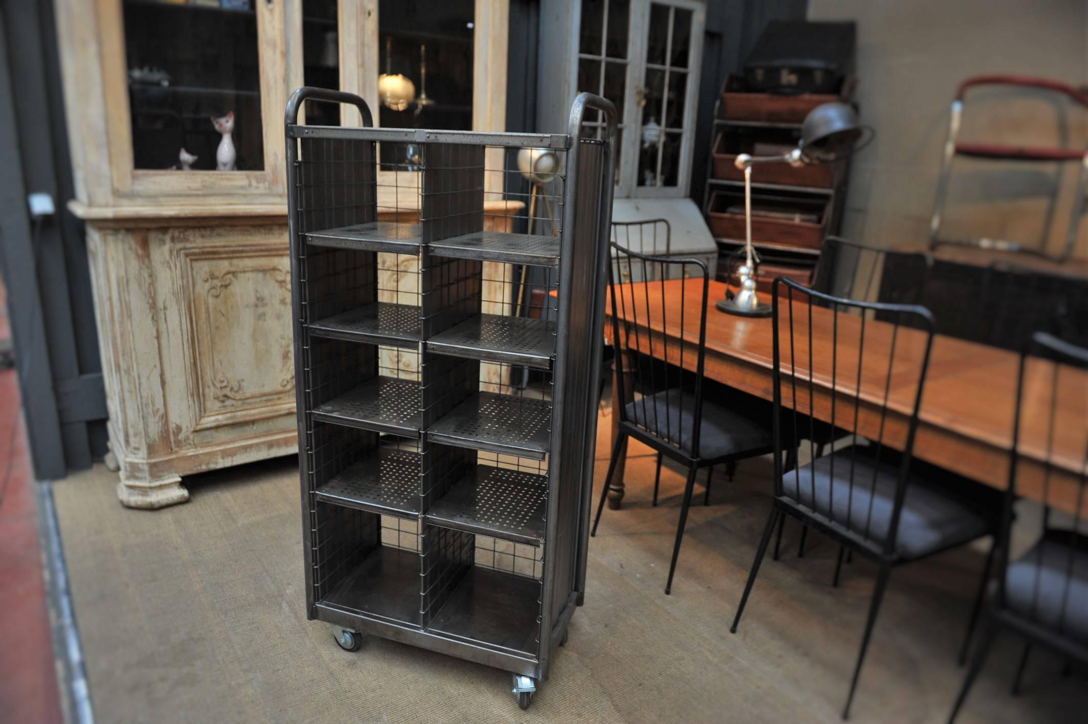 One to four French poste Industrial shelves. Each inside shelves are adjustable and removable very easily. Polished and mat varnish finish, circa 1950.

