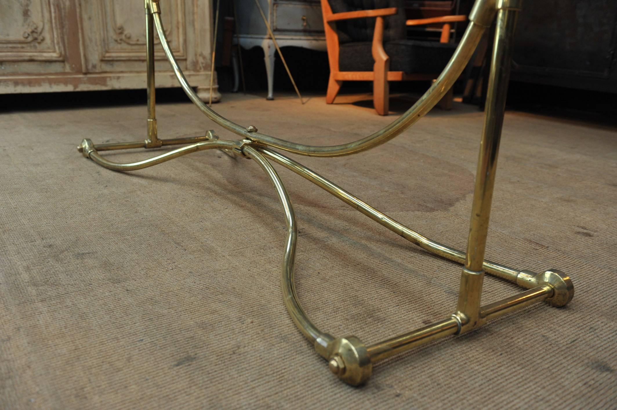 Very fine French shop brass clothes rack or coat hanger. Central bar adjustable in height.