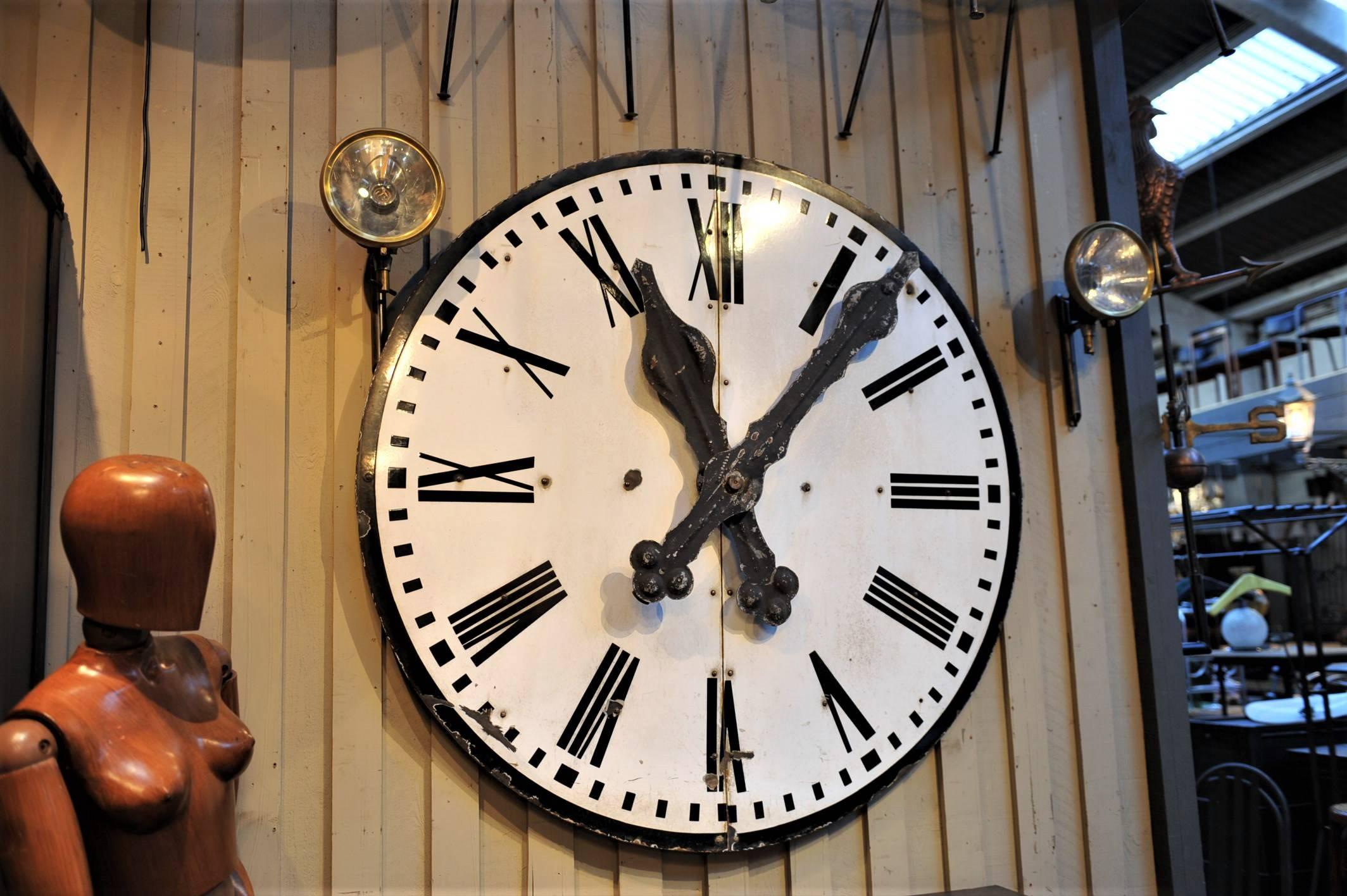 Large French train station iron enamel clock face original hands with Roman numerals. Non-working, deco architectural element, circa 1920.