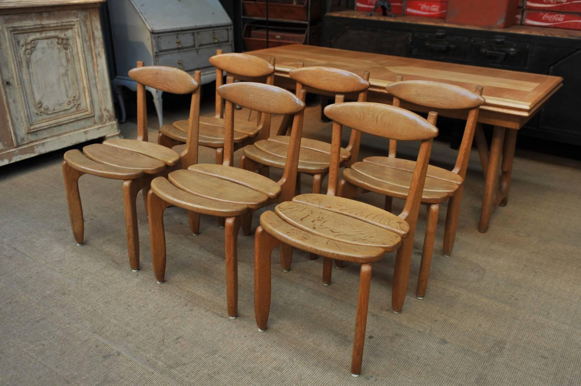 Set of beautiful six dining chairs in solid oak. Designers: Robert Guillerme and Jacques Chambron Model 