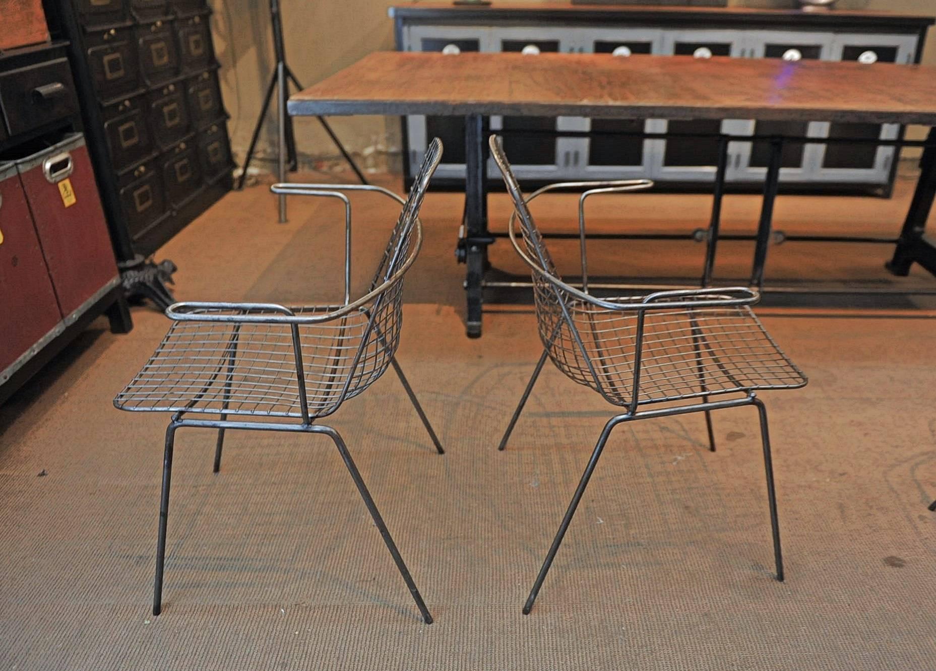 Set of four French 1950 design and Industrial mesh iron stackable armchairs polished finish, circa 1950.