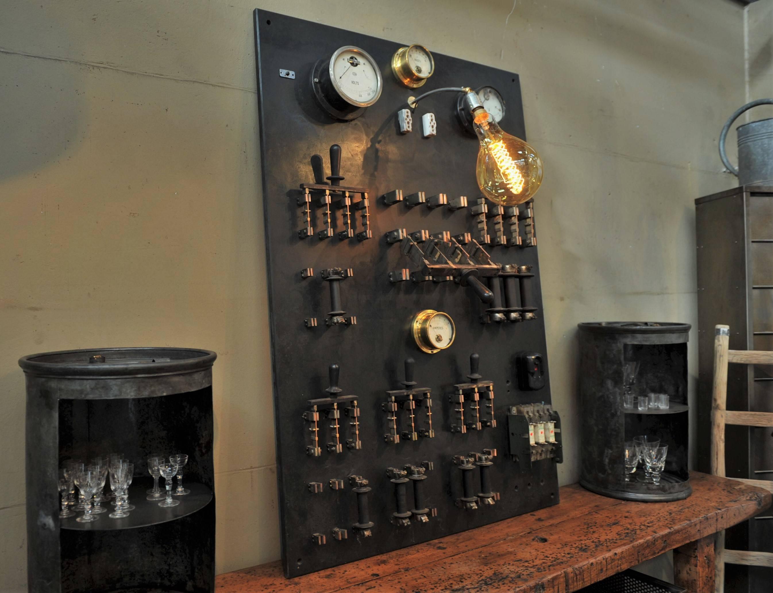 Industrial bakelite brass and iron vintage electric switchboard, circa 1940 from a French factory, with top light rewired for any E27 220 volt screw bulb.
On and off with general switch (red button).
    

        