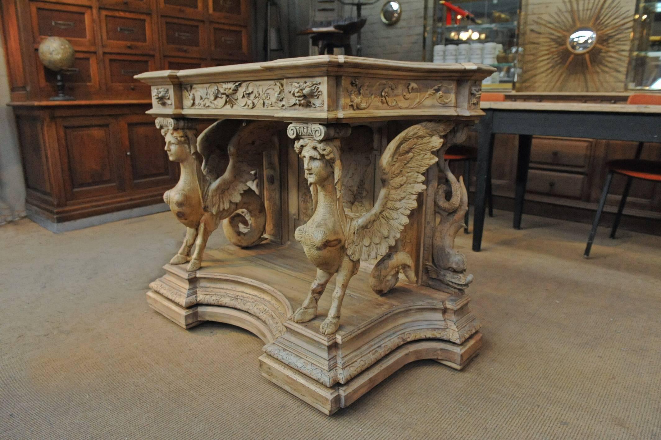 Exceptional solid walnut Napoleon III French console table with: one drawer, two large hand-carved sphinxes, dolphins, dragons and little devil's heads. Natural mat varnish finish, circa 1860.
  