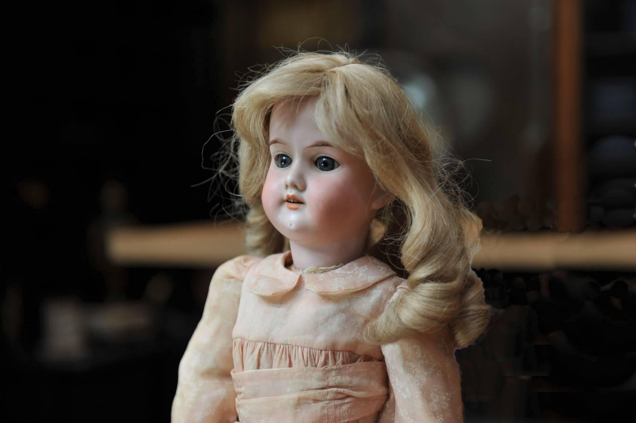 Rare original antique Armand Marseille bisque porcelain doll large size 390. Her big blue glass eyes work perfectly. Open mouth revealing 4 porcelain white upper teeth, original Blonde curly wig, her beautiful bisque head is free of any damage, no