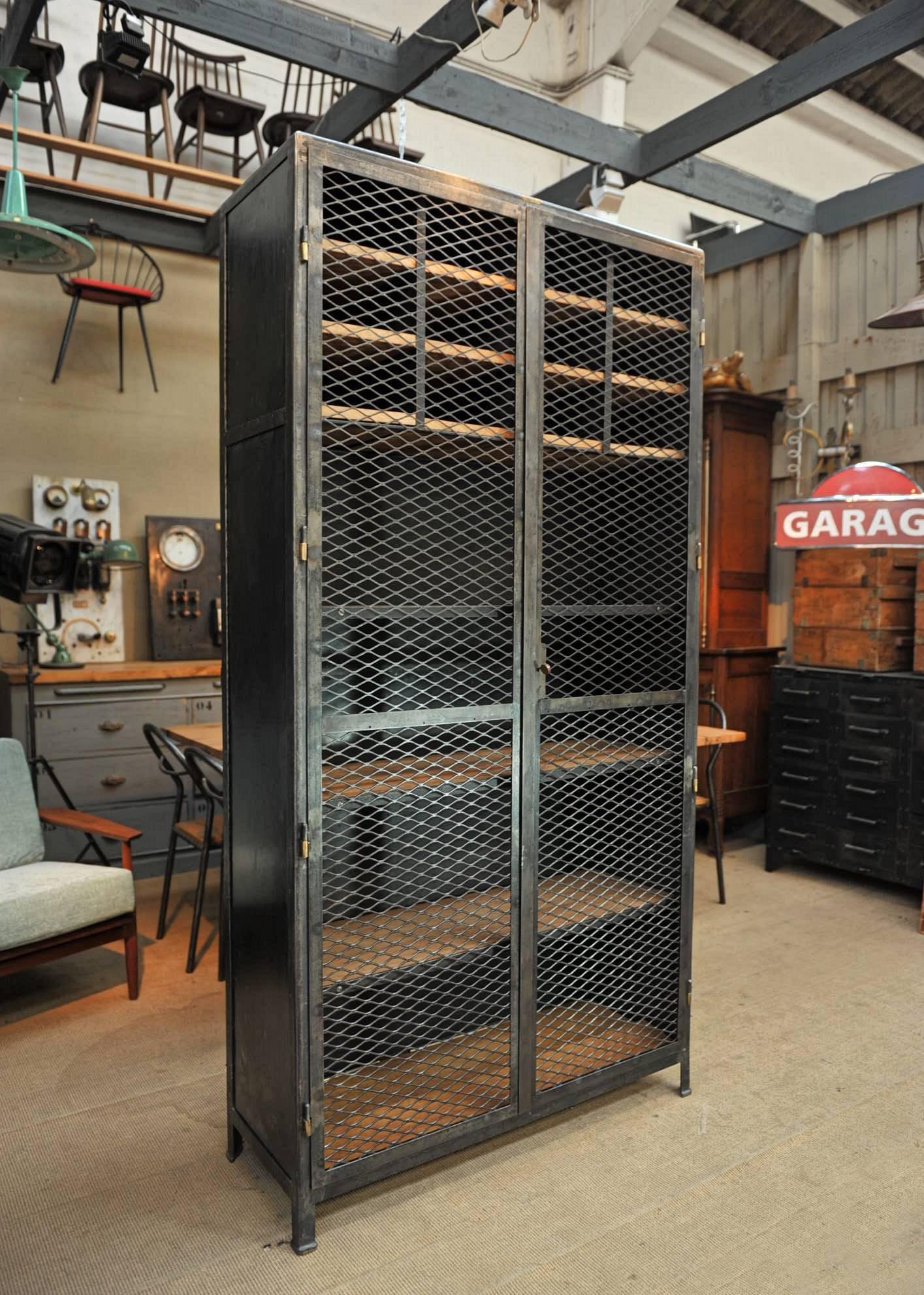 A. Legros Belgium original brass tag iron two mesh doors cabinet. Lower solid oak shelves removable and adjustable every 10 cm.