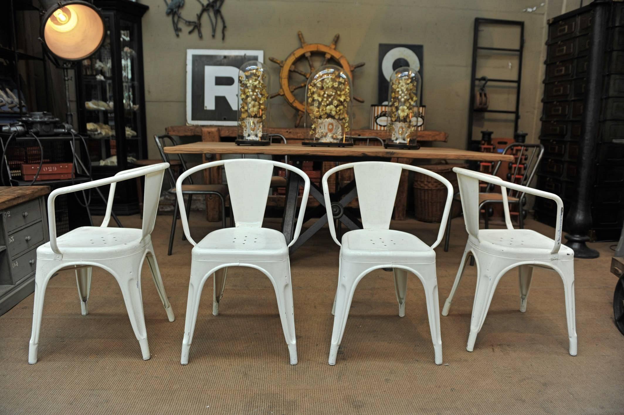 Four iron 1950 metal tolix stackable armchairs, vintage white color (table not included and not available).
     