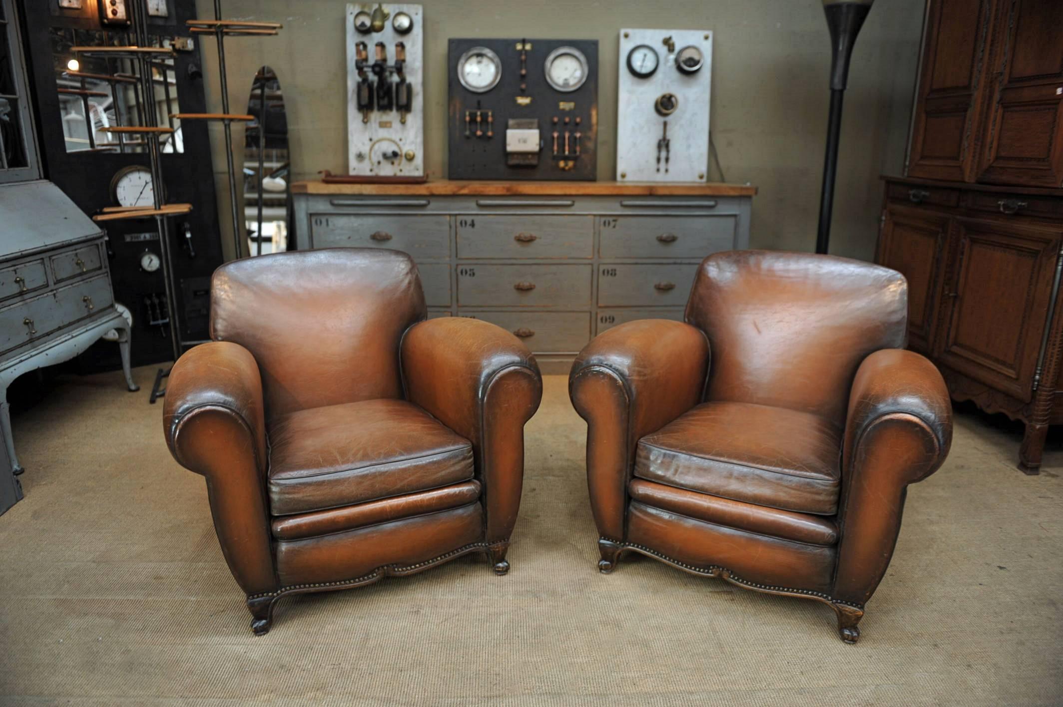 Rare pair of large French brown leather club armchairs,
all original and great condition. Beautifully nail head detailing, circa 1950.
 