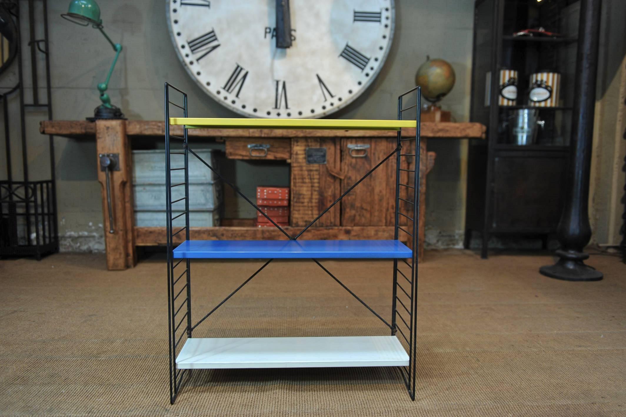 Pair of Mid-Century multi-color metal shelves with three removable and adjustable shelves in original color blue yellow black white and red. Can be taken apart for safe shipping anywhere in the world.


 