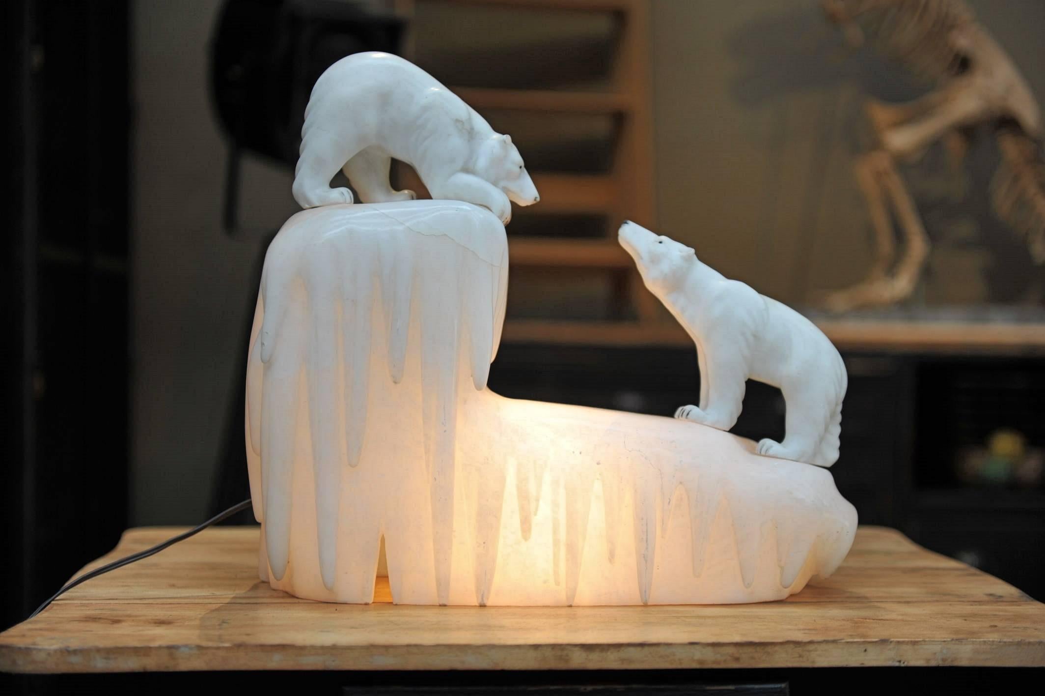 Italian carved alabaster lamp with two removable Carrara marble polar bears on alabaster glacier, circa 1940 rewired.
 