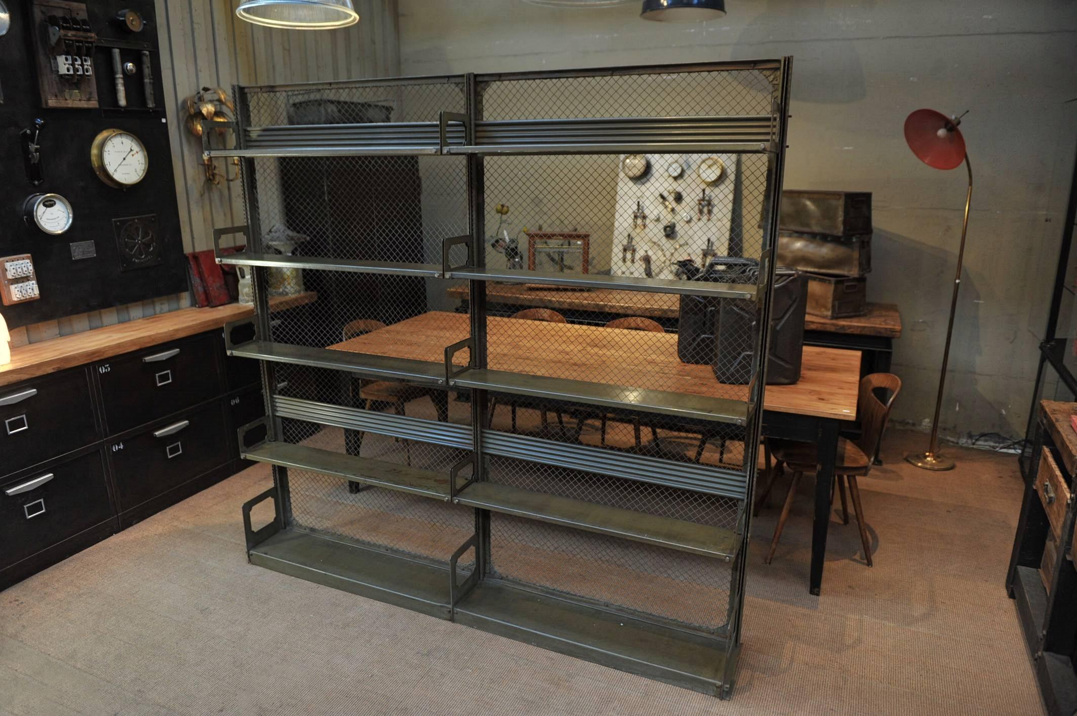 Industrial iron Shelf from Strafor (Forge de Strasboug) with five adjustable and removable tier. Mesh metal back, Very nice original Kaki patina, circa 1930. Comes apart for shipping.