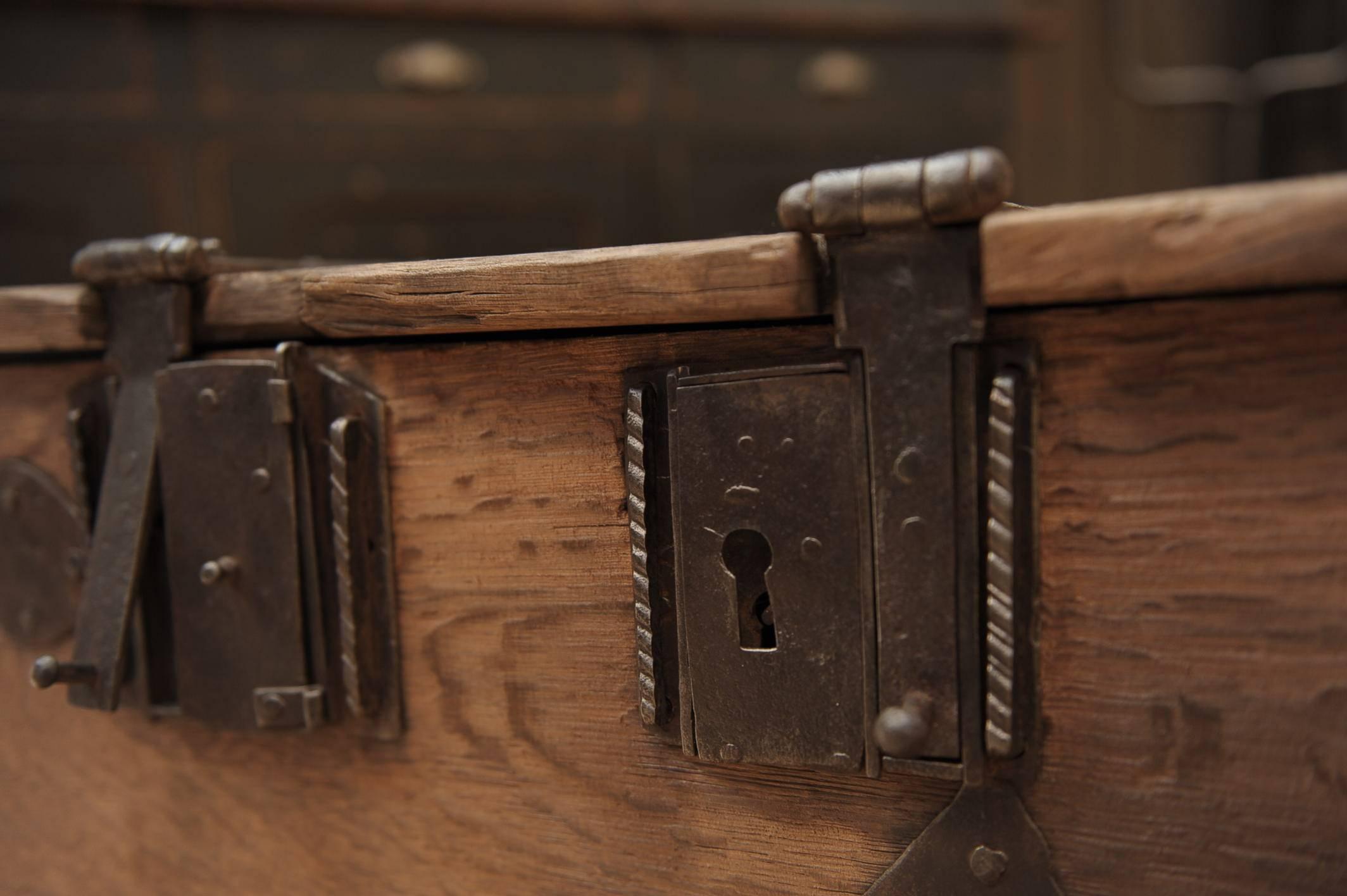 Early 18th century very rare solid oak and iron French trunk. All original locks.