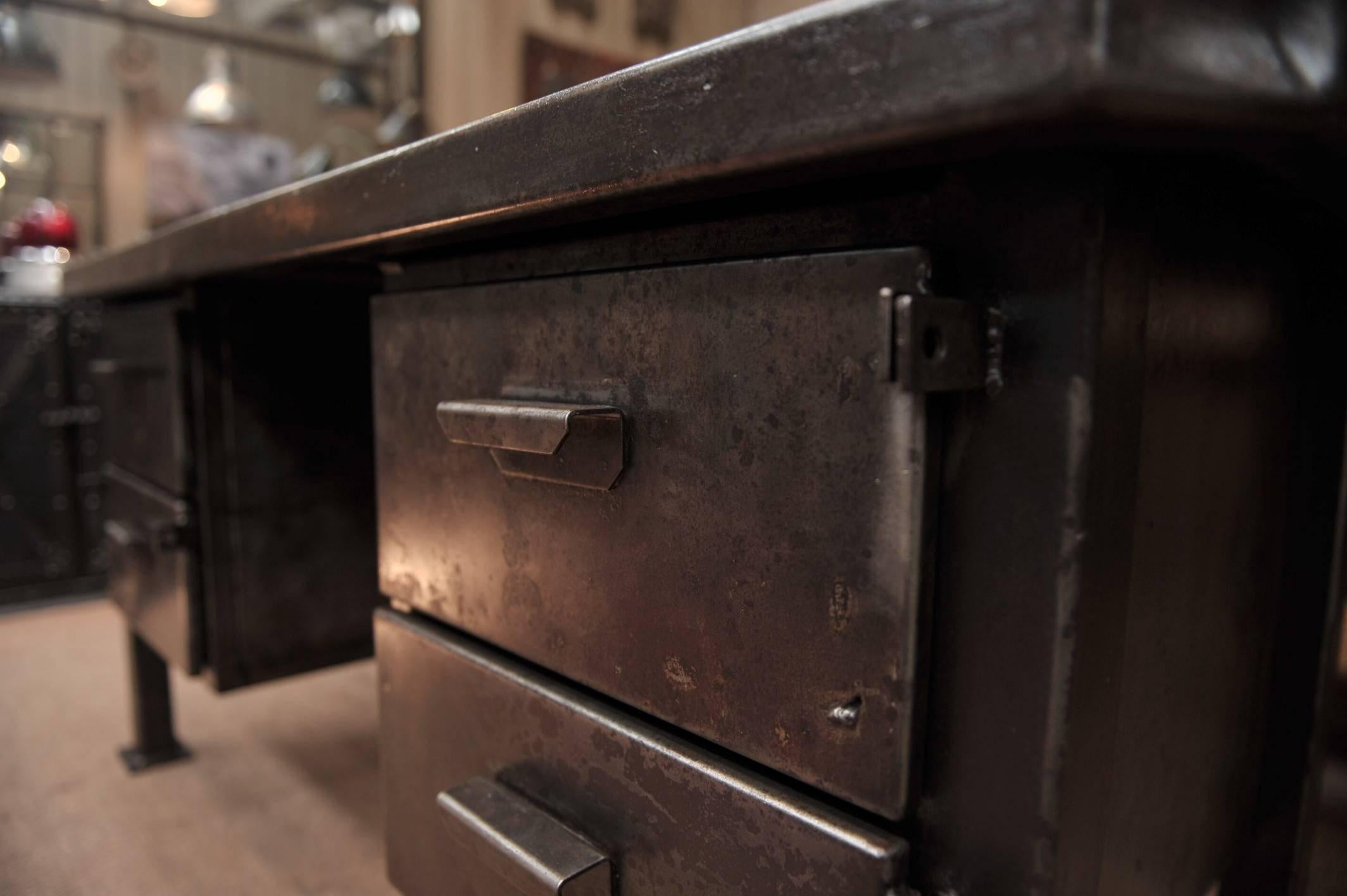 Industrial four-drawer French factory desk polished iron finish, circa 1940.
Weight about 100 kg.