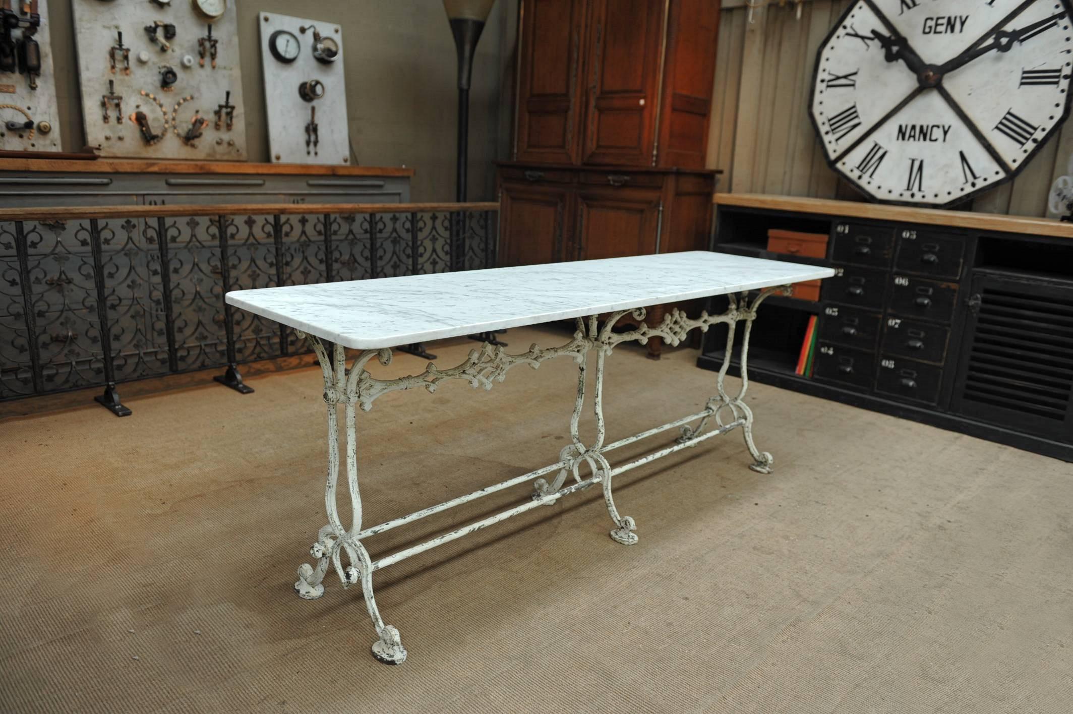 Rare French garden table cast iron base with original old white patina and original white marble-top, circa 1900.