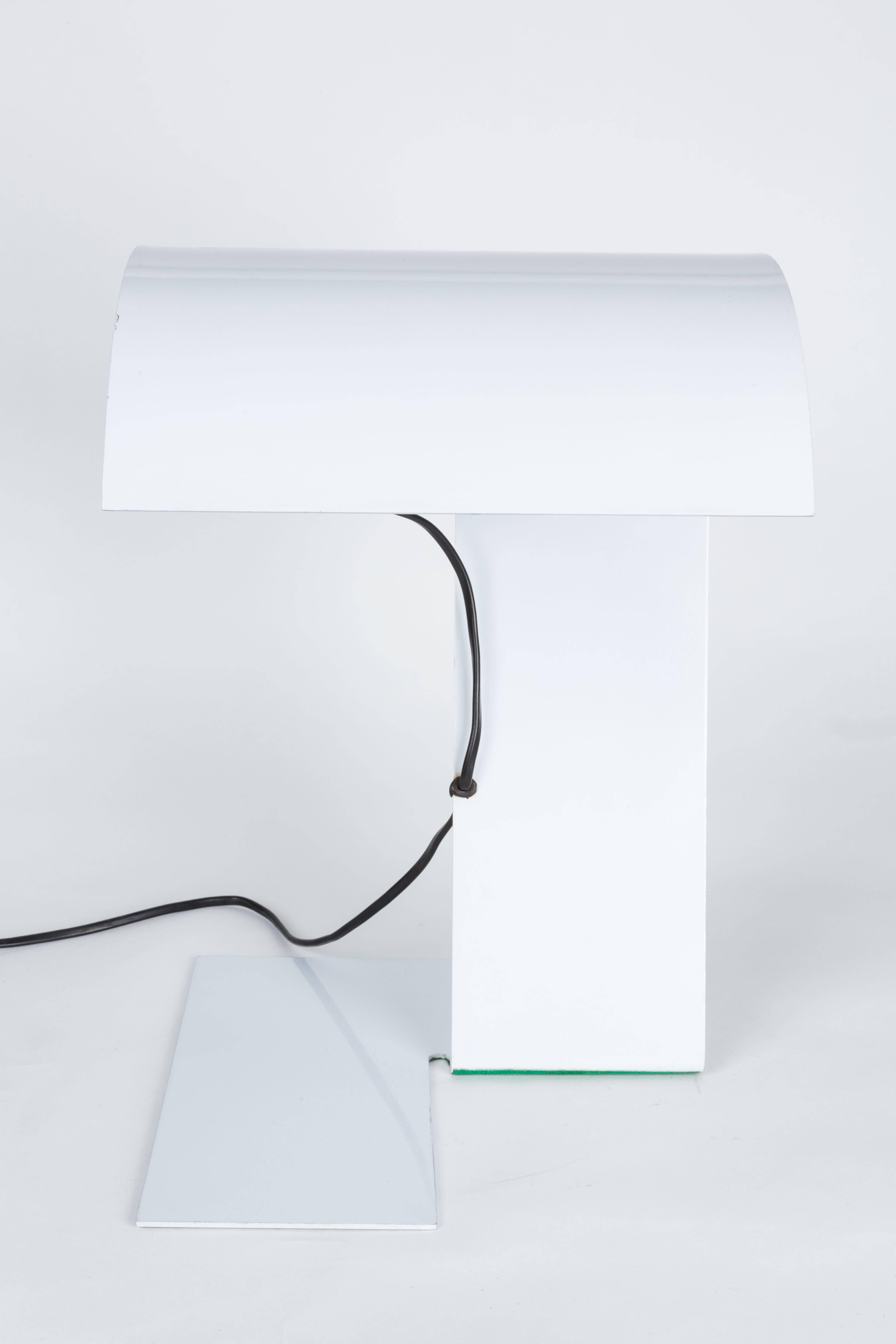 Stilnovo white 'Blitz' table lamp, circa 1972. Executed in white lacquered steel, this ultra refined sculptural lamp was designed by the legendary team of Trabucchi & Vecchi & Volpi for Stilnovo, Italy. Retains original manufacturer's stamp in metal