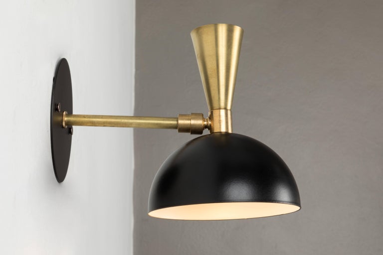 'Lola' brass and metal adjustable sconce. Hand-fabricated by Los Angeles based designer and lighting professional Alvaro Benitez, these highly refined sconces are reminiscent of the iconic midcentury Italian designs of Arteluce and Stilnovo.