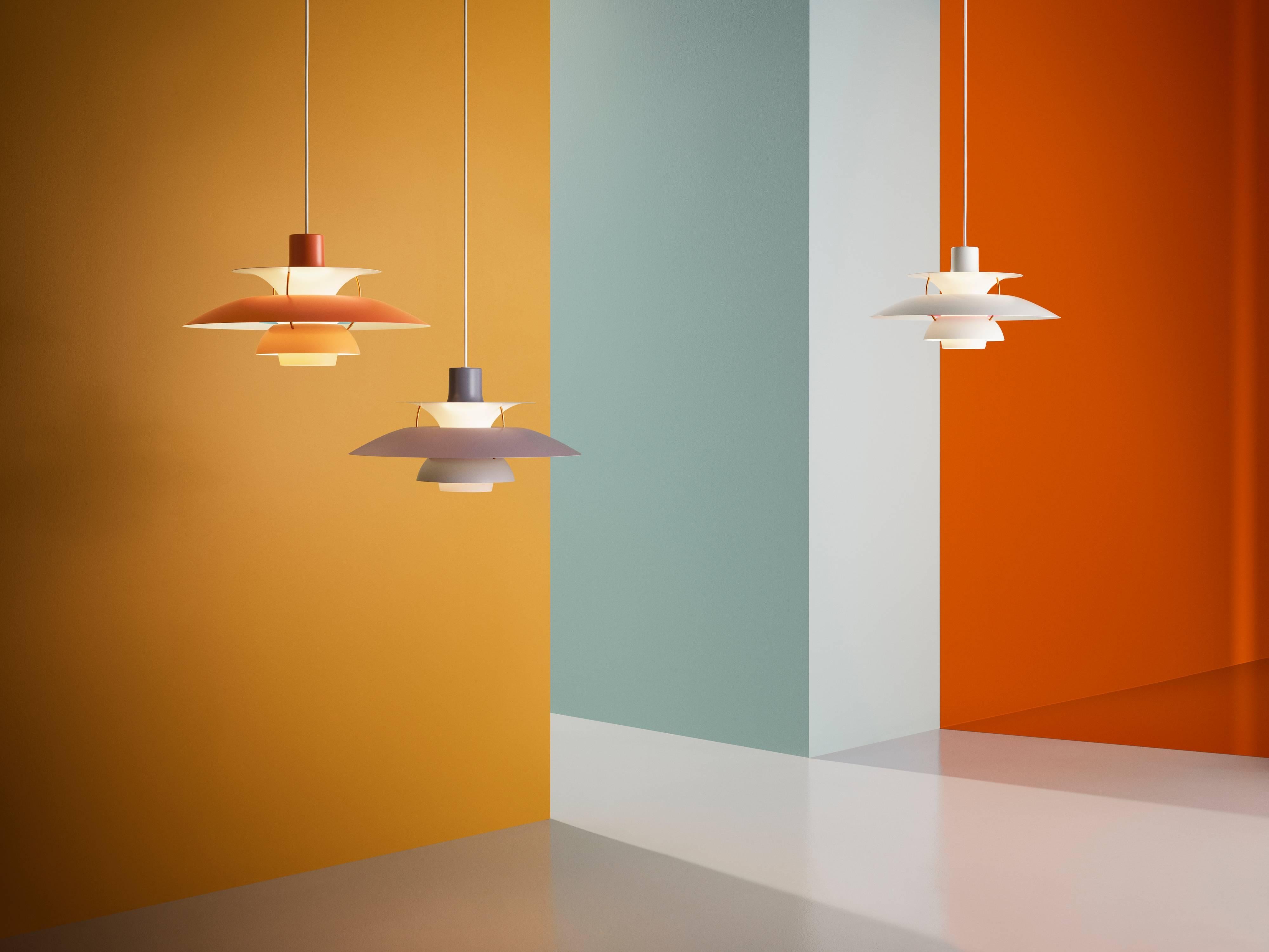Poul Henningsen PH 5 pendant for Louis Poulsen in orange. Poul Henningsen introduced his iconic PH 5 pendant light in 1958. Six decades later, the PH 5 remains the bestselling design in the Louis Poulsen's portfolio. The PH 5's painted metal shades