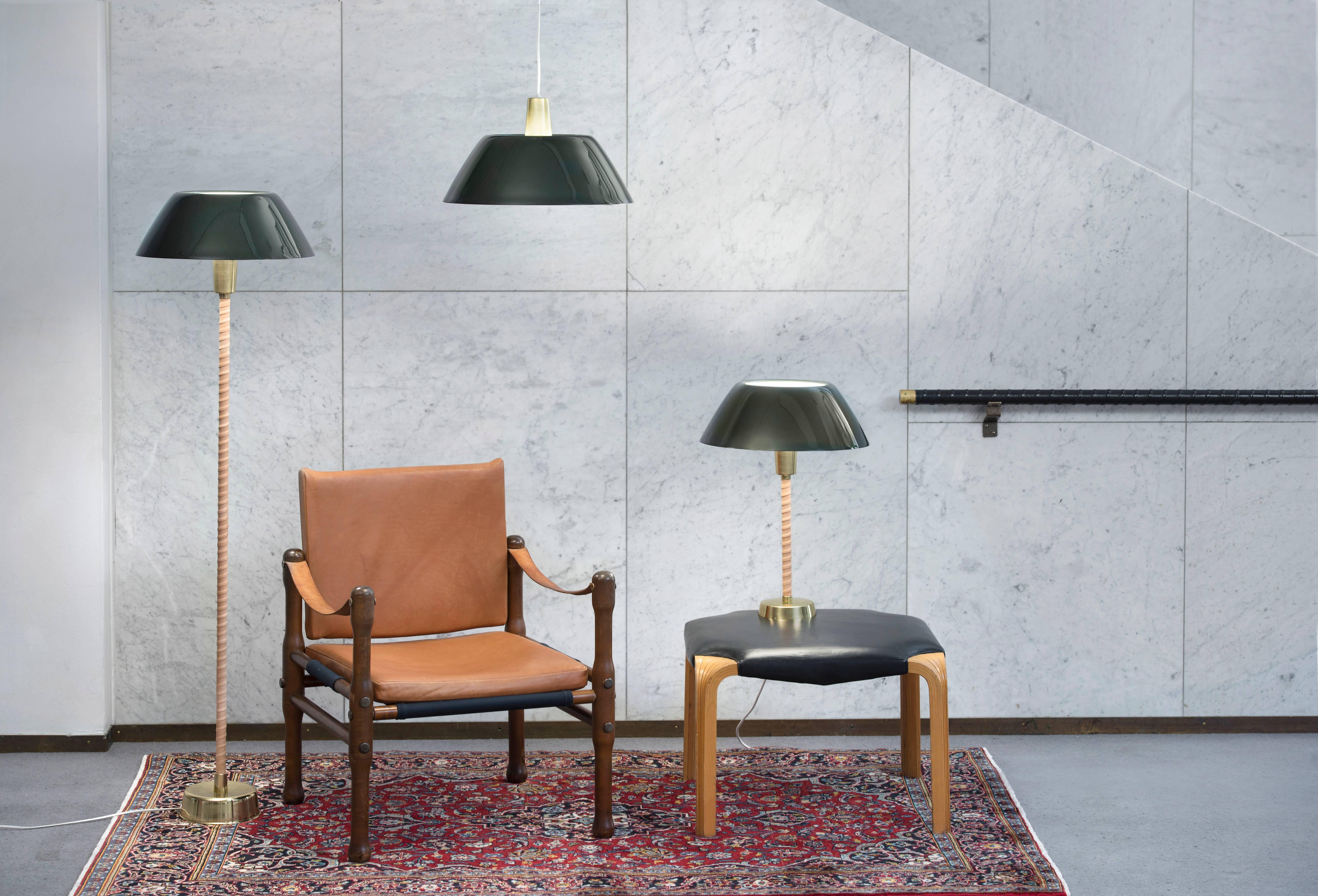 Lisa Johansson-Pape 'Senator' table lamp for Innolux Oy. An iconic pendant lamp designed by the Finnish master and executed in brass and ultra dark green painted aluminum shade. An authorized re-edition made to exacting standards using the highest