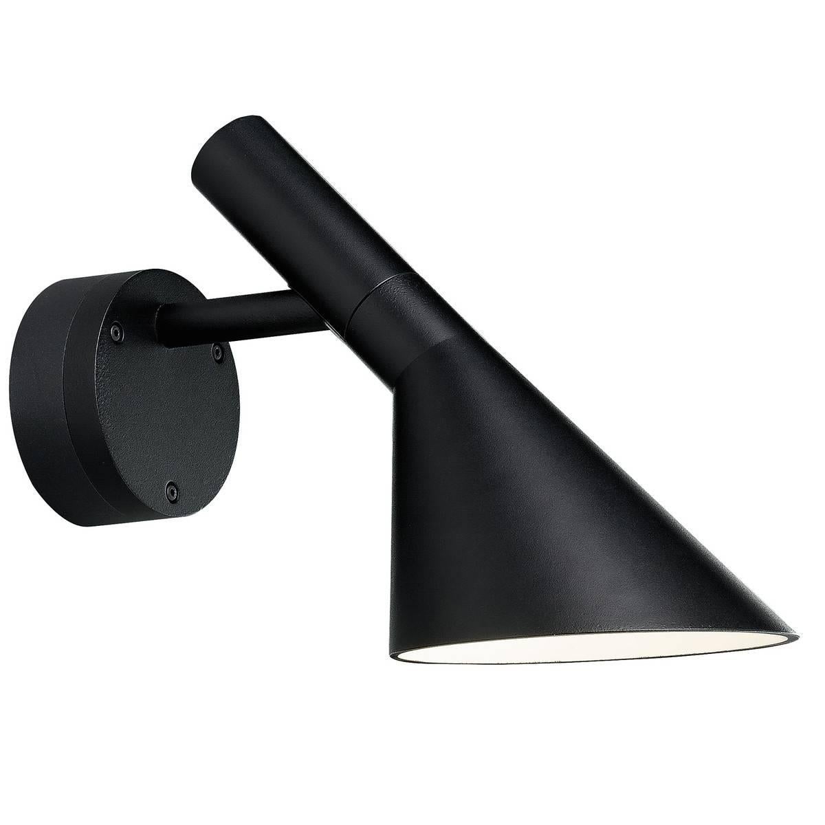 Arne Jacobsen AJ 50 outdoor wall light for Louis Poulsen. Based on his iconic 1960 Danish Modern design. The fixture emits downward directed light. The shade is painted white on the inside to ensure a soft comfortable light distribution with a