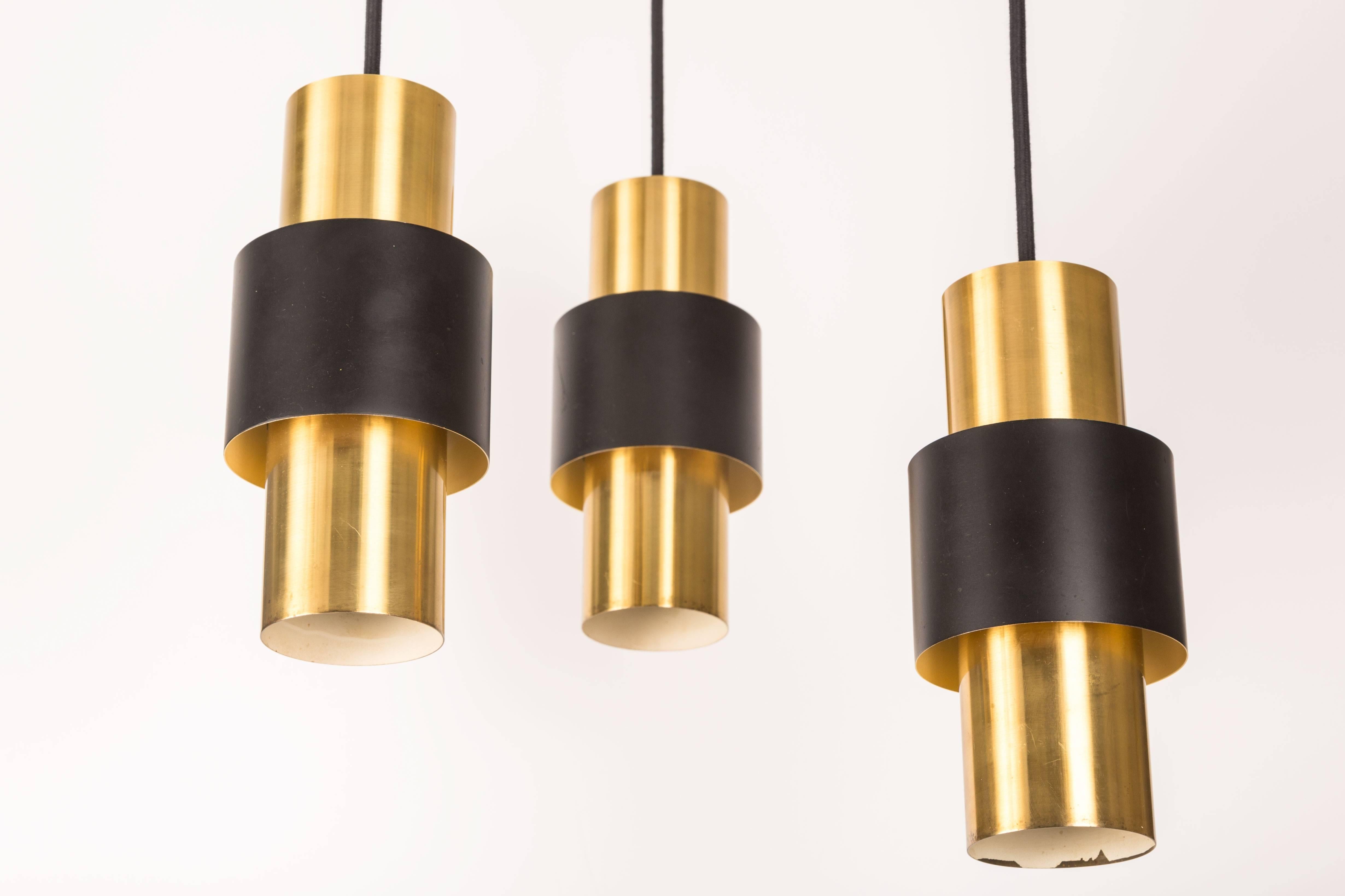 1950s Jo Hammerborg Pendants for Fog & Morup executed in brass and black enameled metal.

Price is for the set of 3. 
