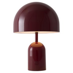 Lampada LED portatile "Bell" di Tom Dixon, color bordeaux
