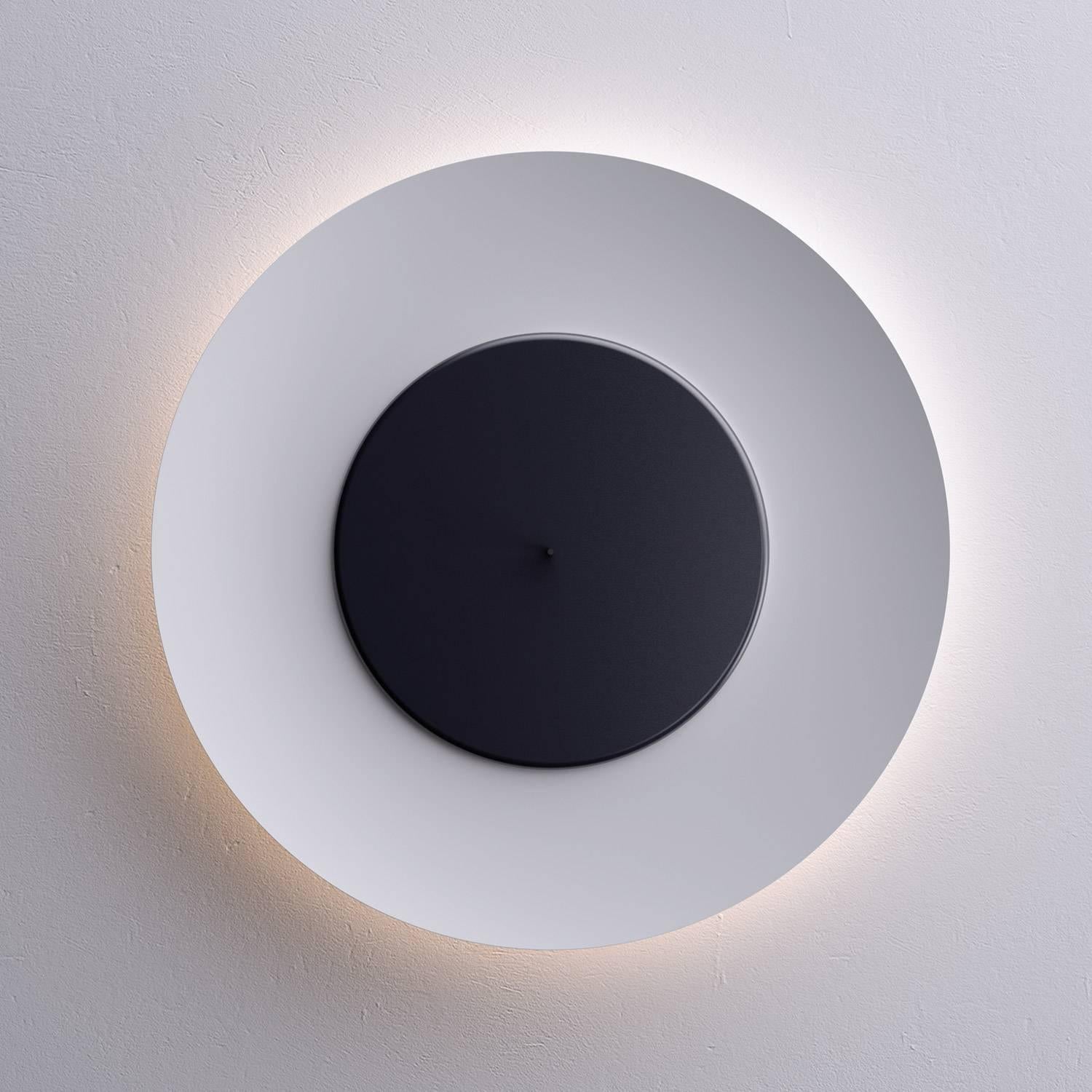 Fontana Arte 'Lunaire' wall or ceiling Lights. Designed by Ferre´ol Babin.

Price is per item for both all white and black/white models. Please specify color when ordering.

Lunaire is a wall and ceiling lamp with a surprising light effect,