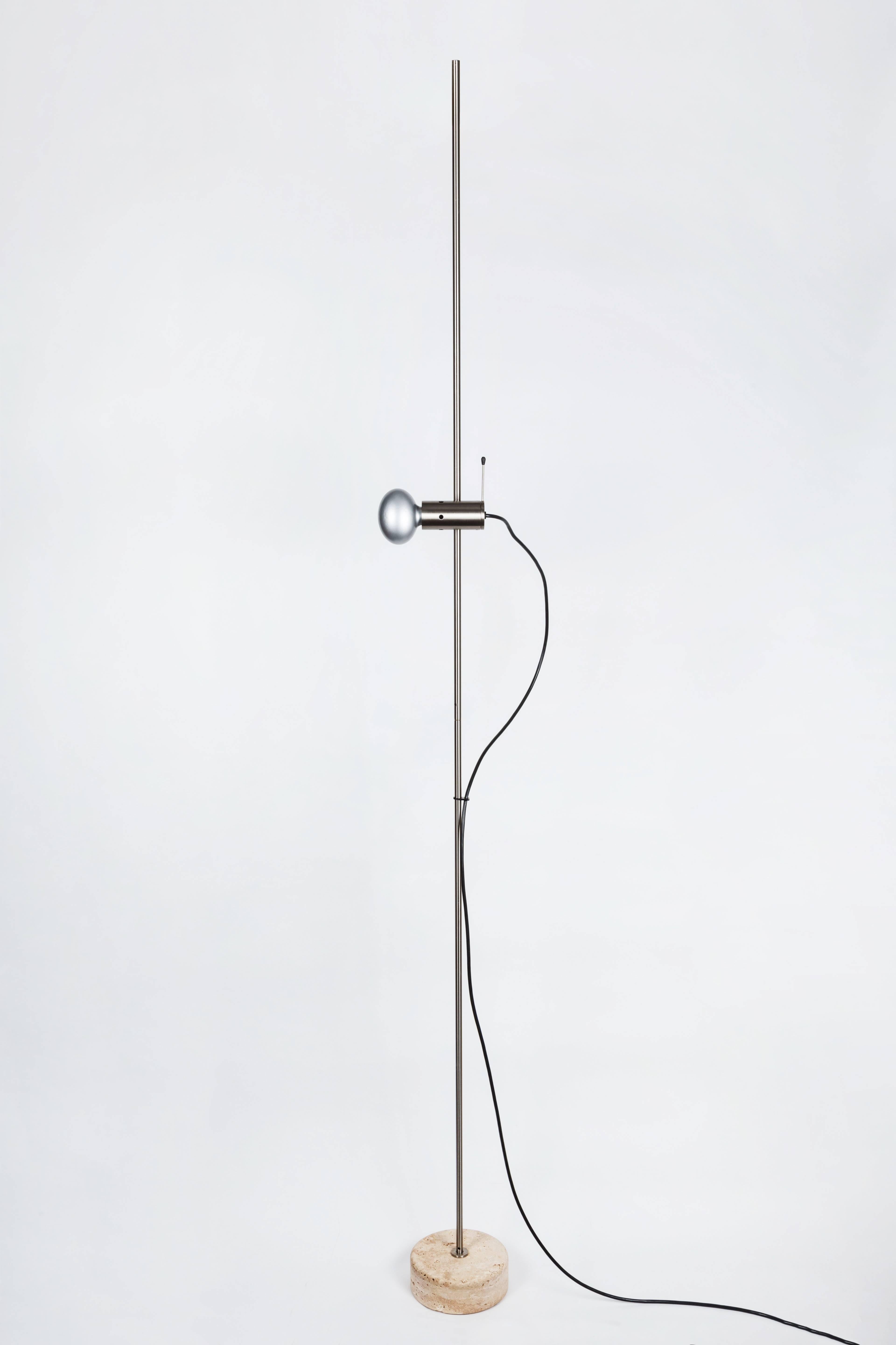 Tito Agnoli '387' floor lamp for Oluce. Designed in 1954, this ultra-refined design is now considered to be a key forerunner of minimalism. Executed in nickel plated metal and travertine base with original Oluce manufacturer's label. This later