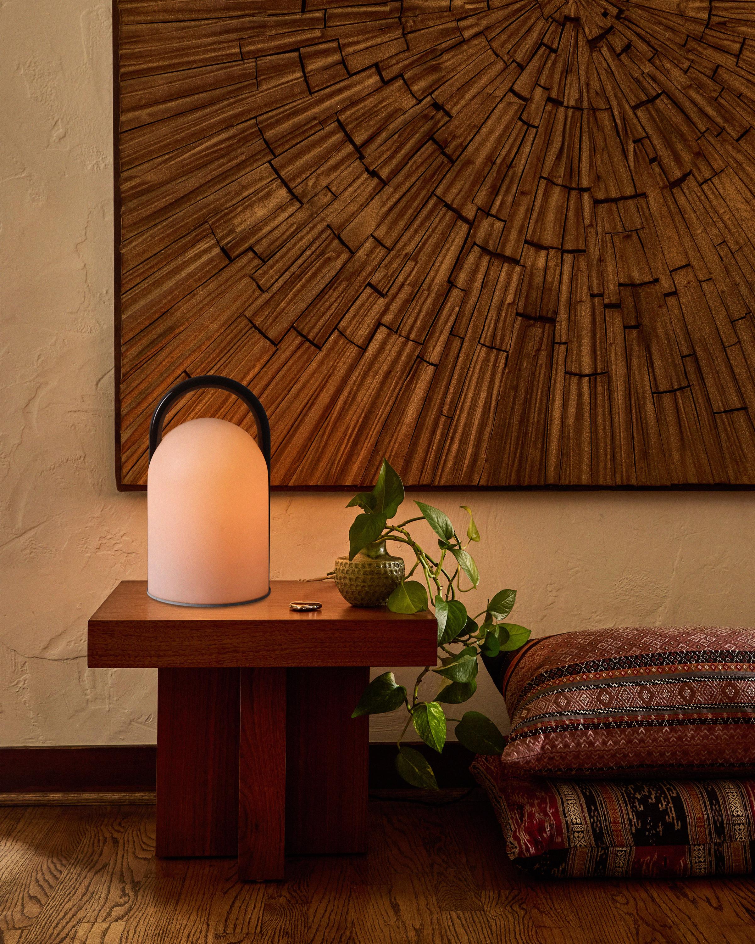 1980s Romolo Lanciani Brown and Glass 'Tender' Table Lamp for Tronconi

Executed in opaline glass and brown glossy enameled metal handle, the 'Tender' is a modern take on 19th century railroad tender lights. The handle is functional, and allows the