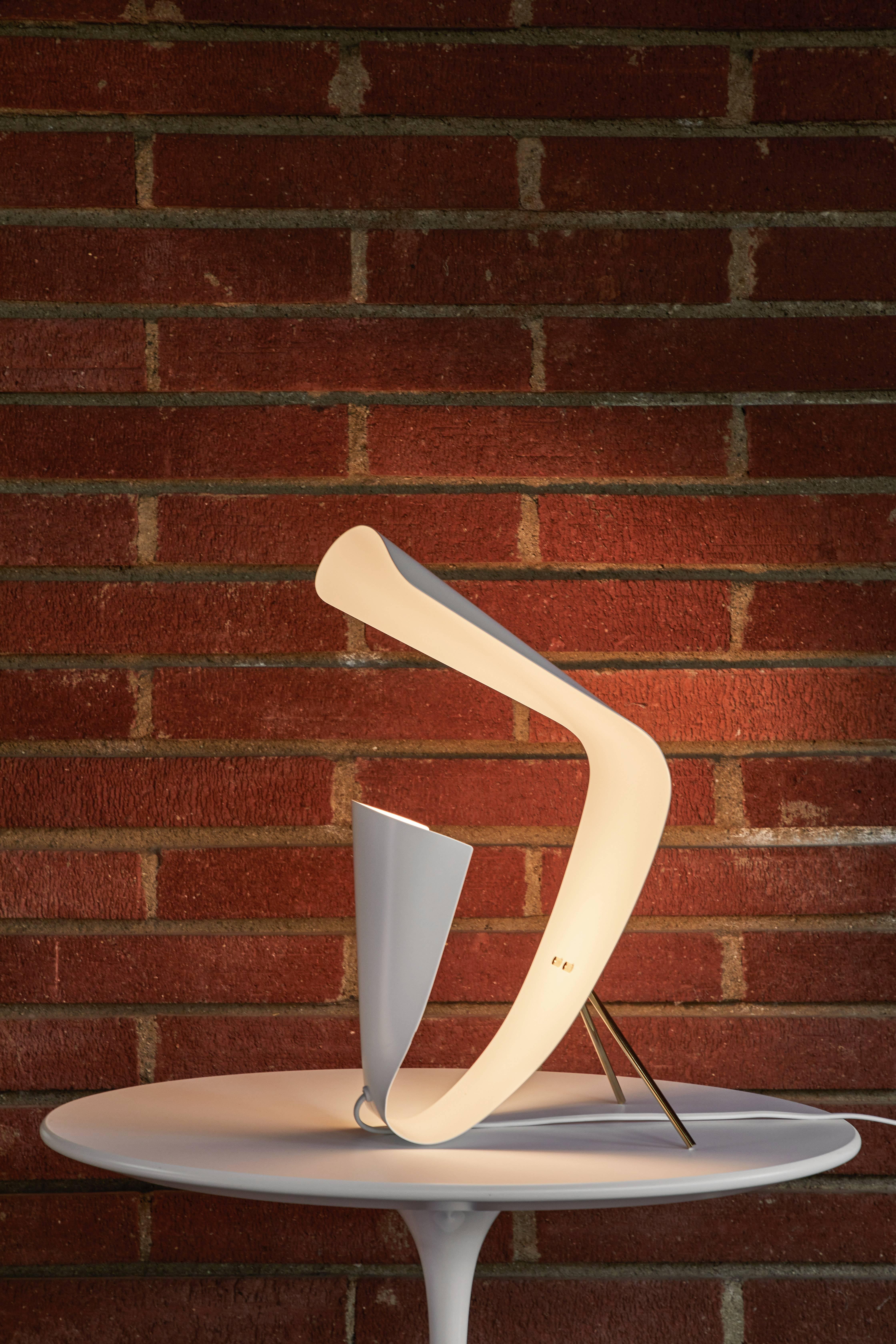 Michel Buffet 'B 201' white table lamp. Originally designed in 1953, this clean pair was acquired in France in the 2010s and are part of a more recent authorized re-edition made with many of the same small-scale manufacturing techniques and