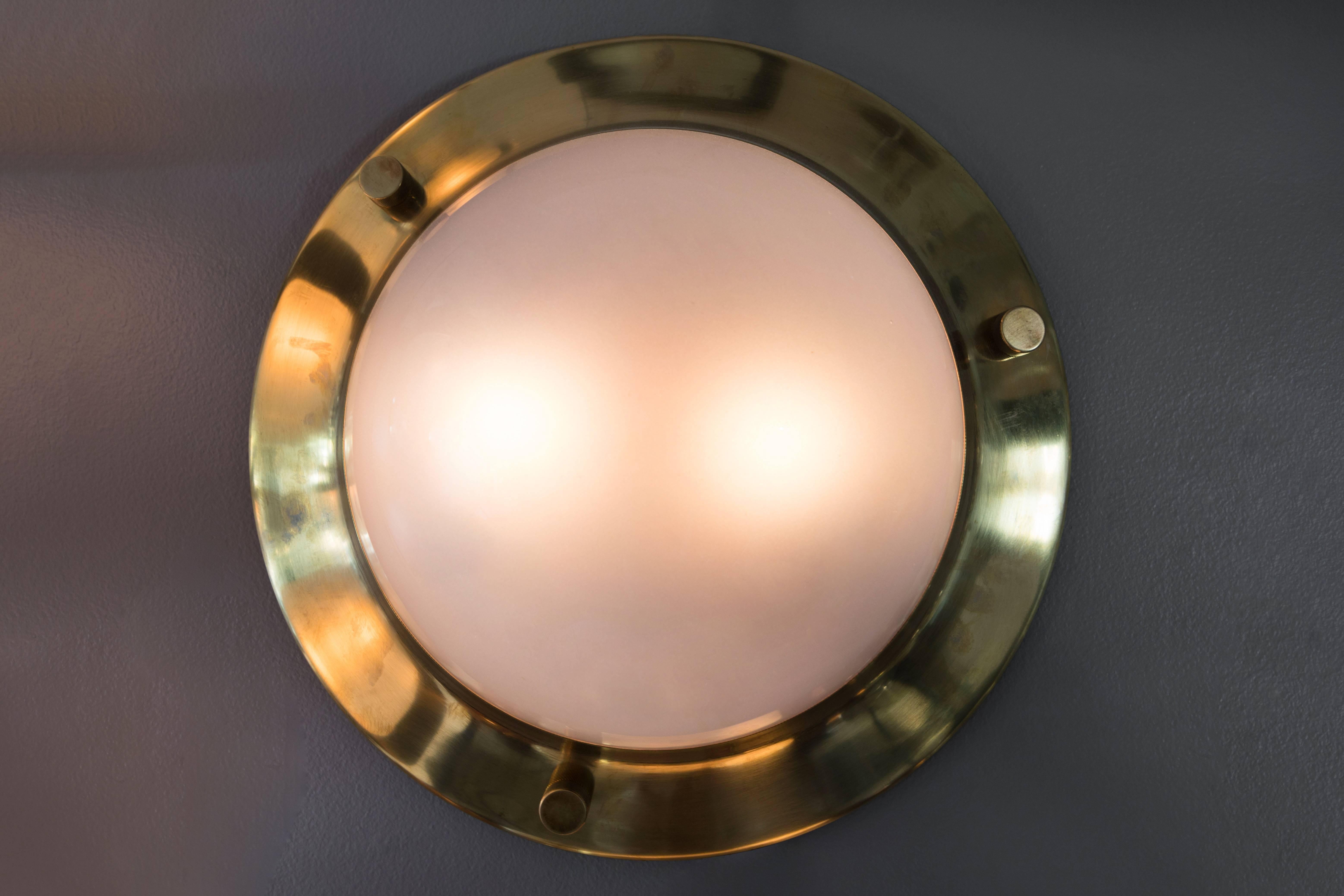 1960s Luigi Caccia Dominioni large 'Tommy' wall or ceiling lights for Azucena. An highly refined and elegant design executed in polished brass and opaline glass, Italy, circa 1965. Azucena was one of the most innovative lighting design companies in