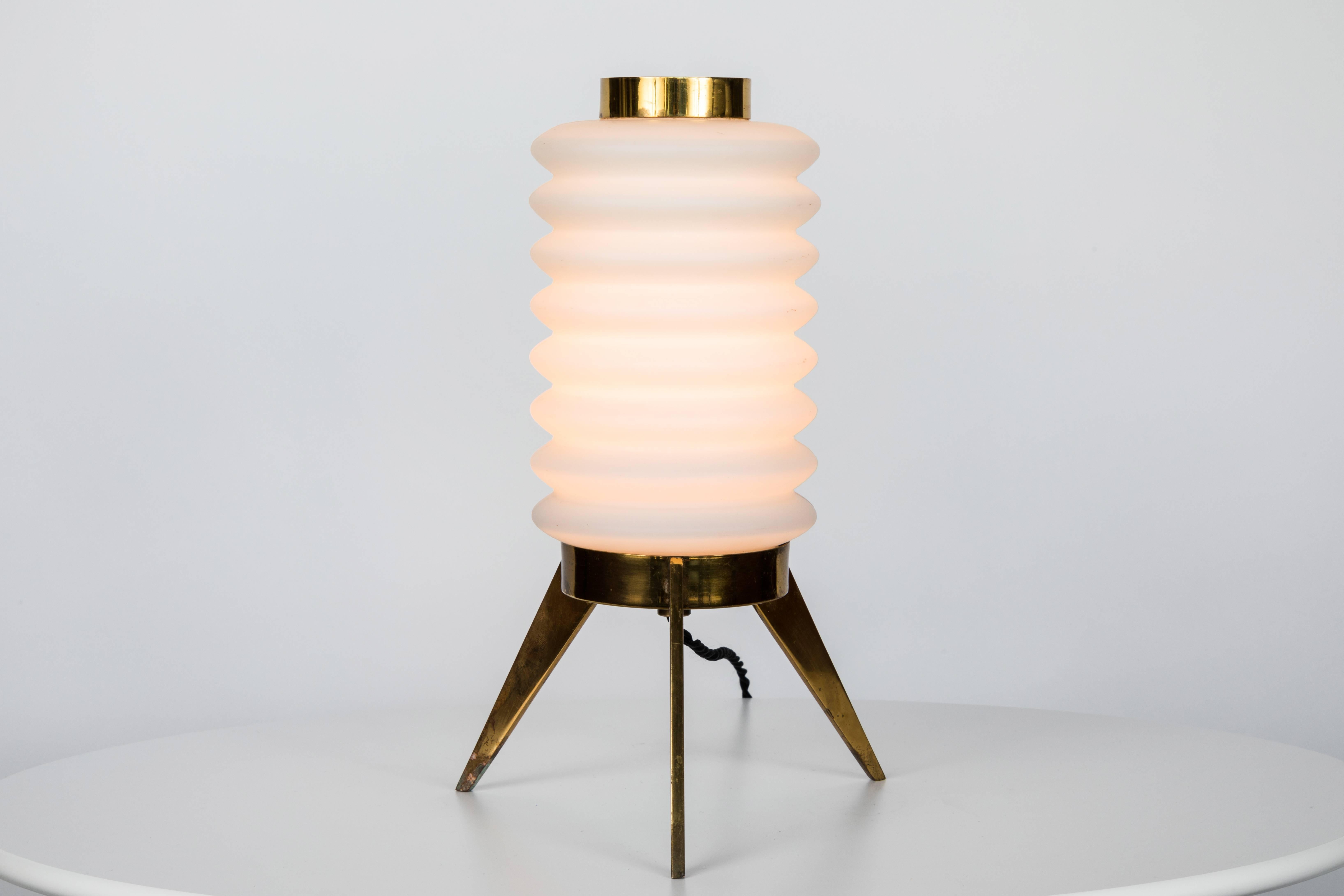 1950s Angelo Lelli glass and brass tripod table lamp for Arredoluce. An extremely rare design executed in patinated brass and sculpturally blown opaline glass. An exquisite example of the iconic early work of Lelli and Arredoluce Monza.