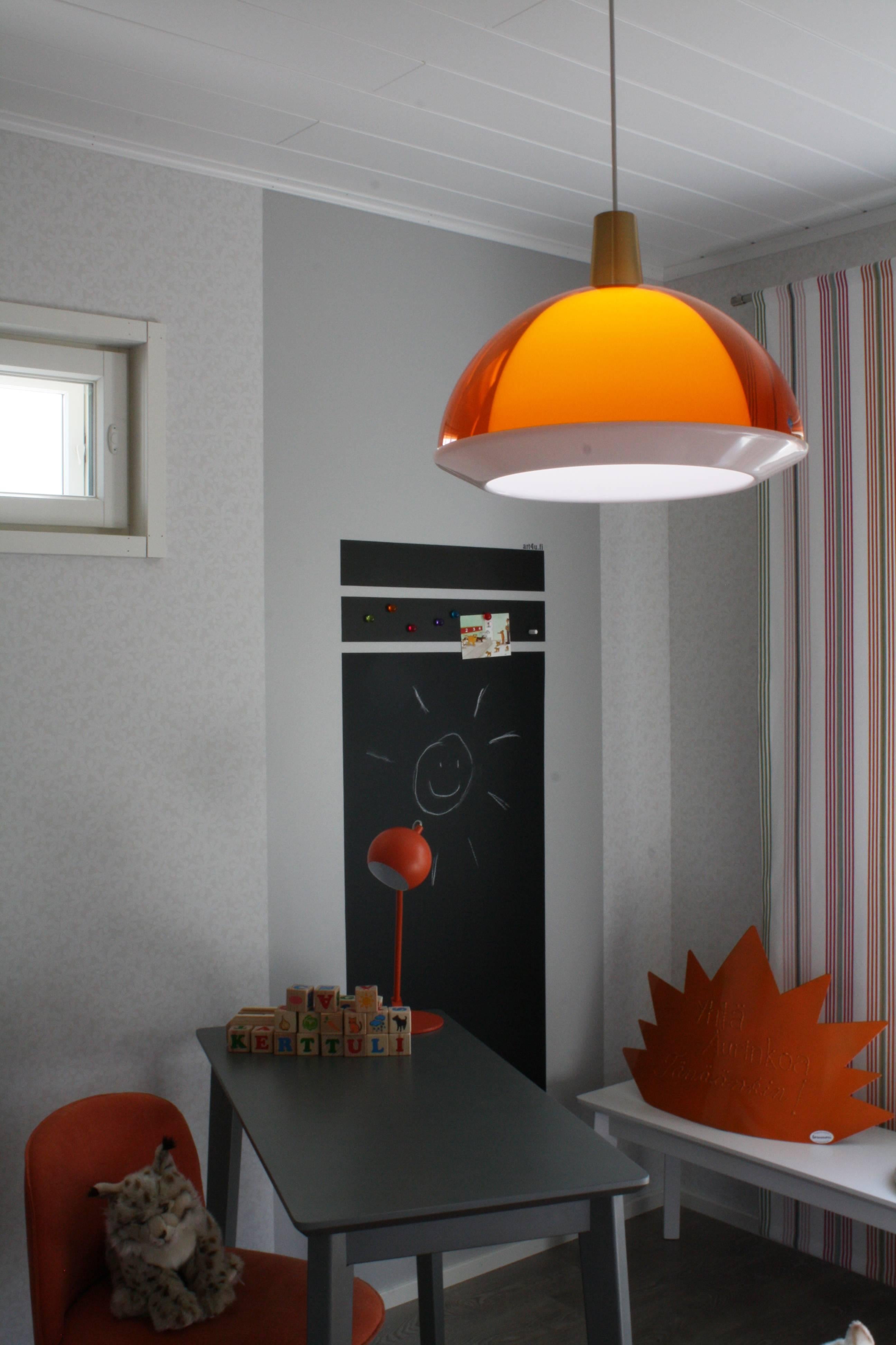 Yki Nummi orange 'Kuplat' pendant for Innolux Oy, Finland. Designed in 1959, Nummi's iconic light consists of two acrylic shades of different colors, one nesting inside the other. The name Kuplat means bubbles in Finnish. As Nummi once astutely