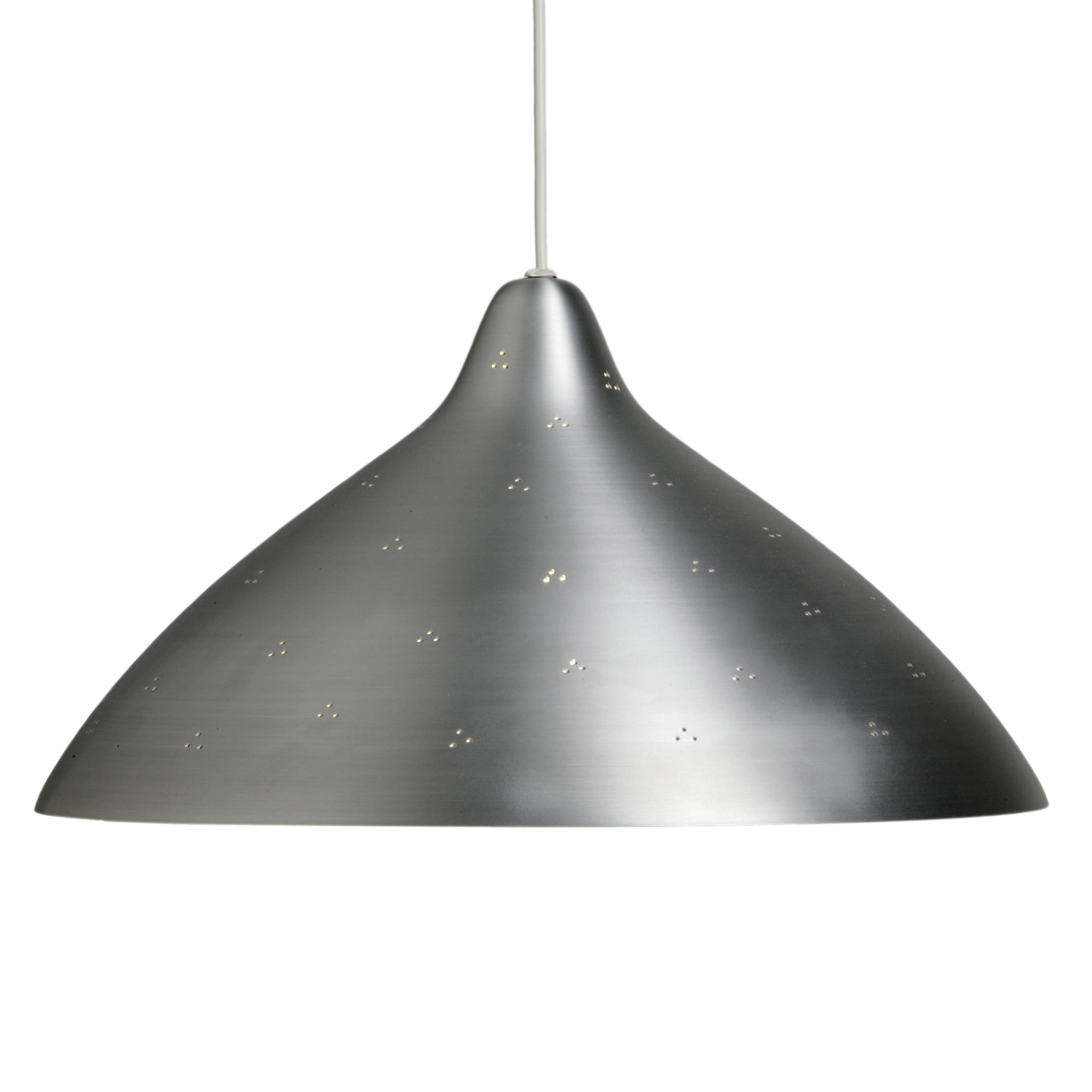 Lisa Johansson-Pape large silver perforated 'Hat' metal pendant for Innolux Oy. Originally designed in 1947, these authorized re-editions are true to the original charming simplicity of Pape's iconic design. The white interior of each metallic shade