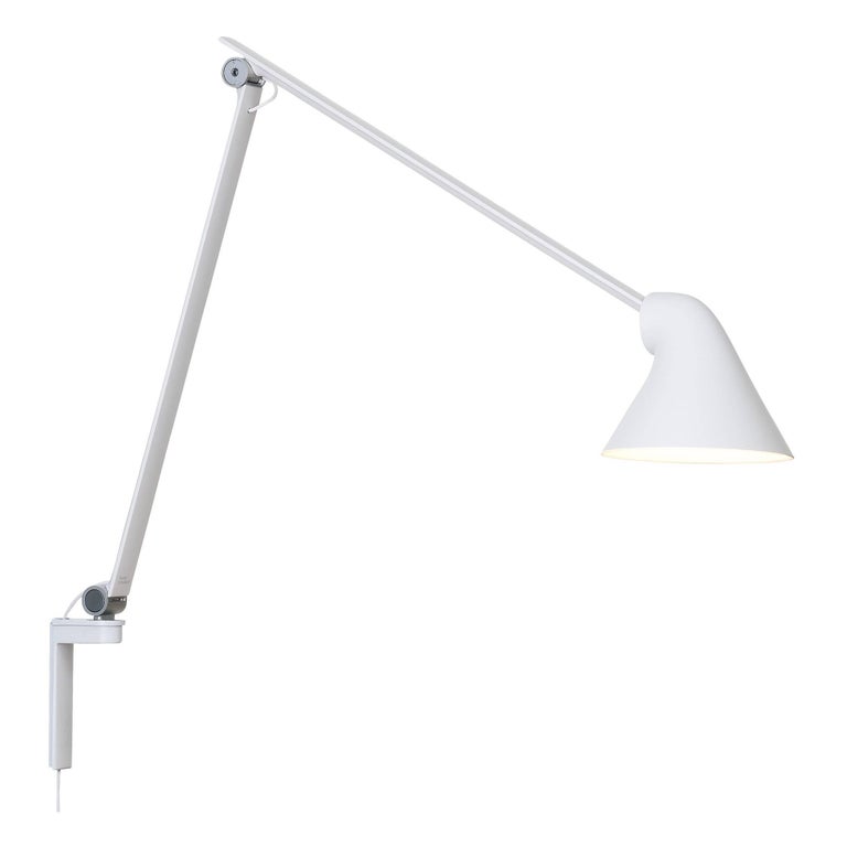 Oki Sato NJP white long wall light for Louis Poulsen. Designed by Oki Sato from Japan's Nendo design studio. Provides direct light perfect for modern living rooms, bedrooms, and home offices. An decorative and functional lighting solution for work